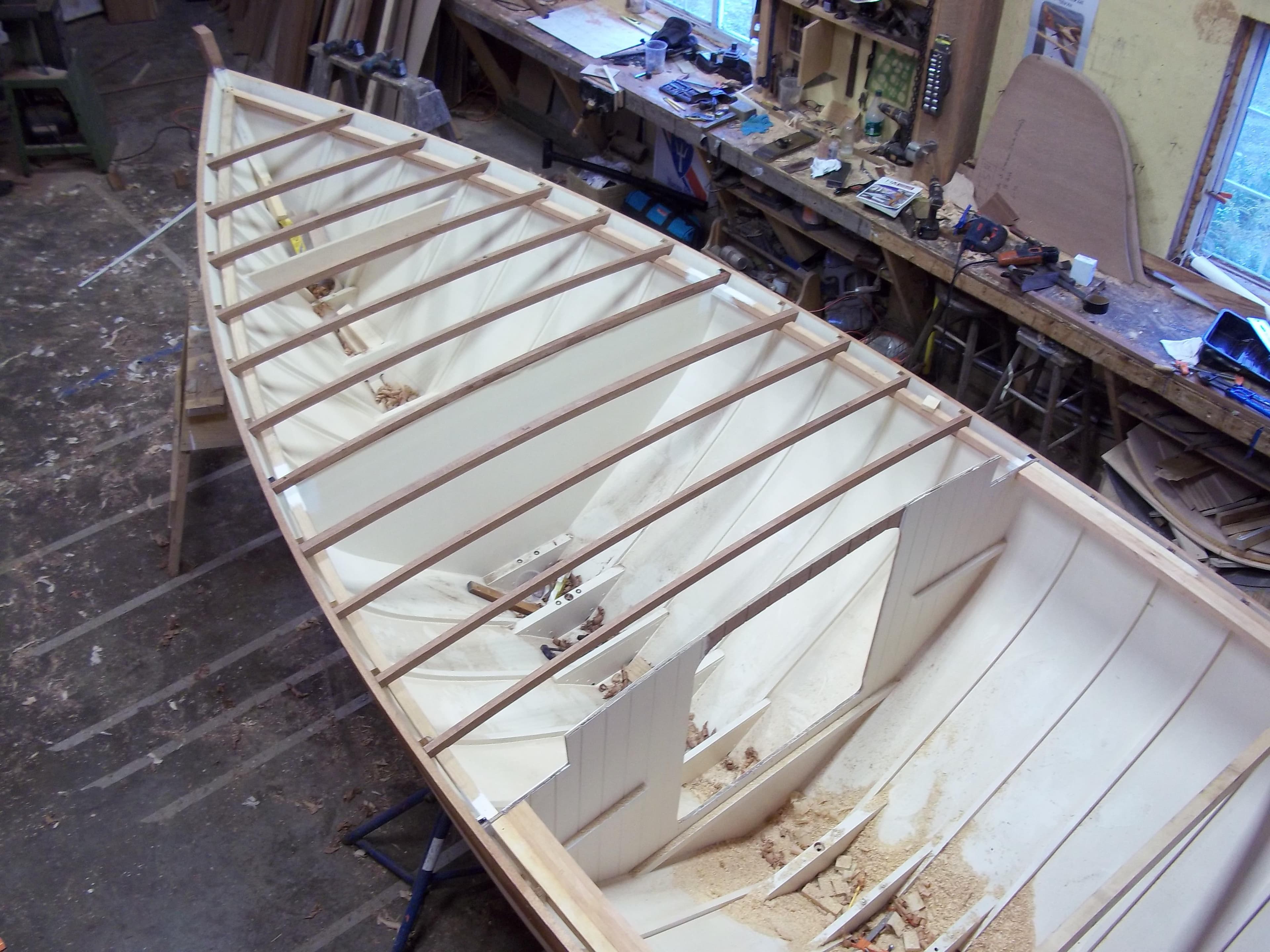 Herreshoff Fish Class 2011 boat under construction in a workshop setting.