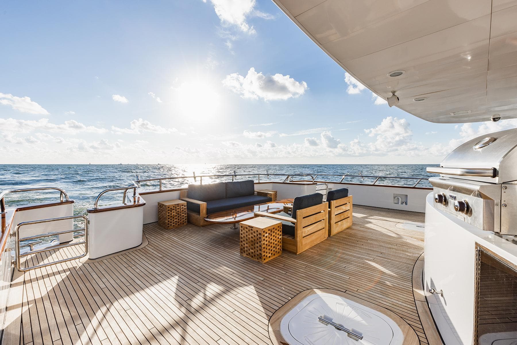 Luxurious deck of 2009 Crystal Motoryacht at sunset.