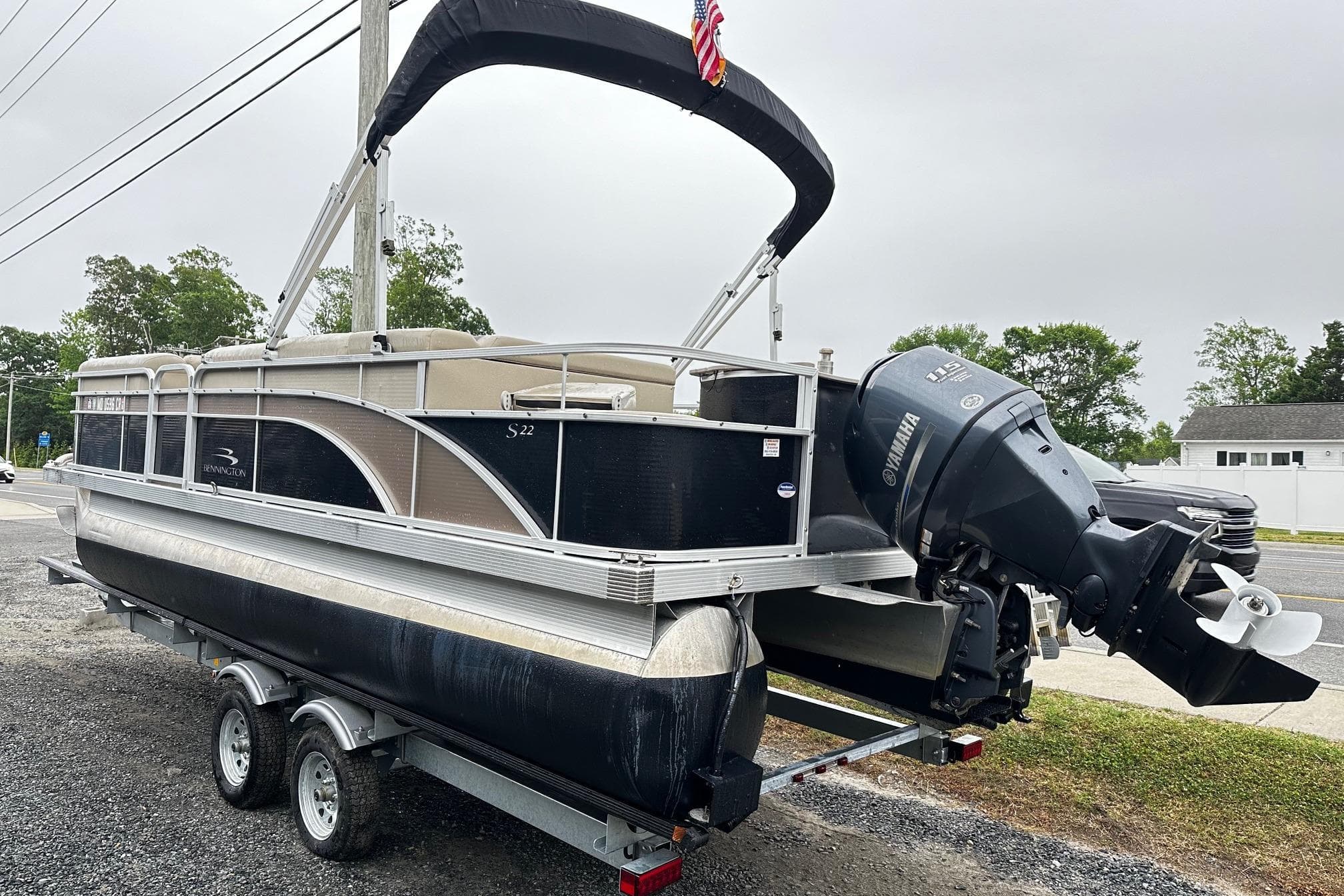 2014 Bennington 2275SL Pontoon boat on trailer with Yamaha outboard motor.