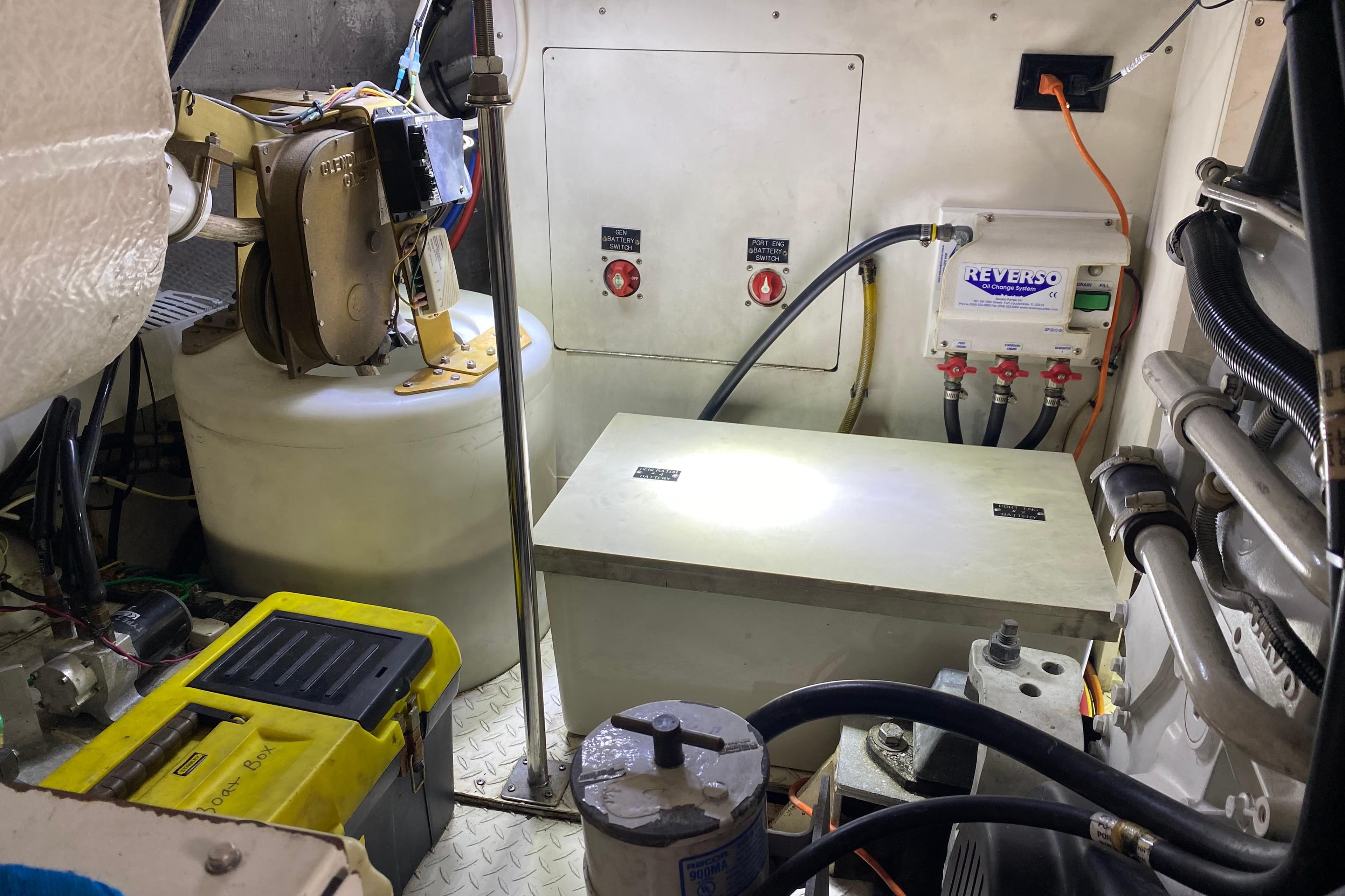 Engine room of 2006 Cruisers Yachts 520 Express with mechanical components and wiring.