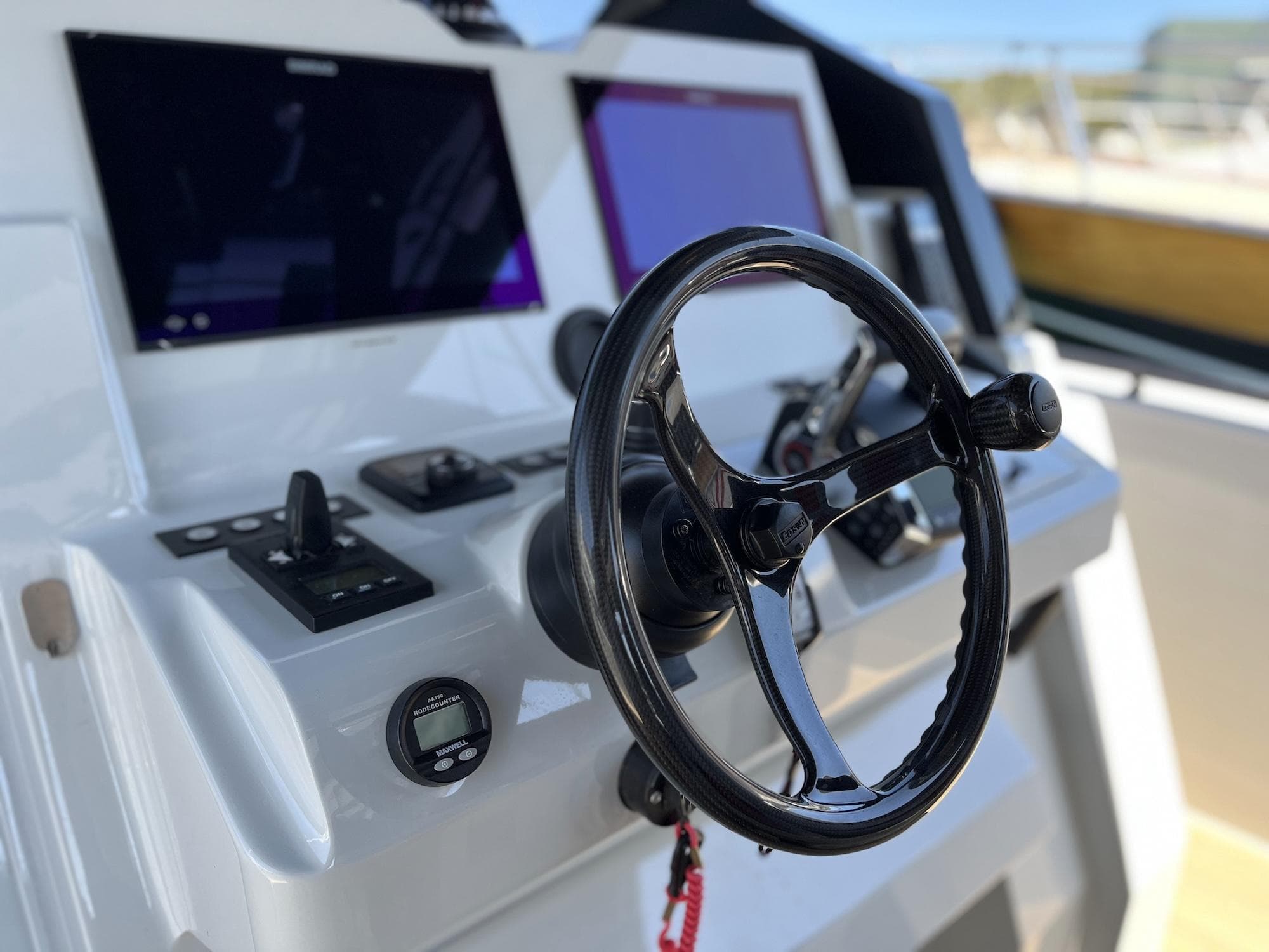 2023 Chaser 54 Laguna boat dashboard with steering wheel and control panels.