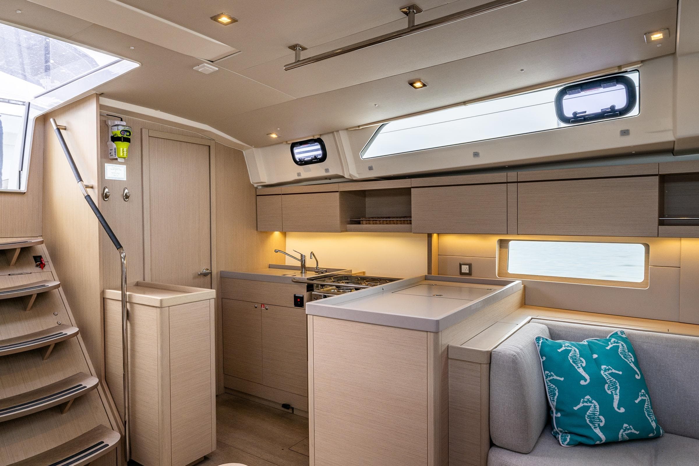 Interior of 2020 Beneteau Oceanis 46.1 yacht, featuring modern kitchen and seating area.