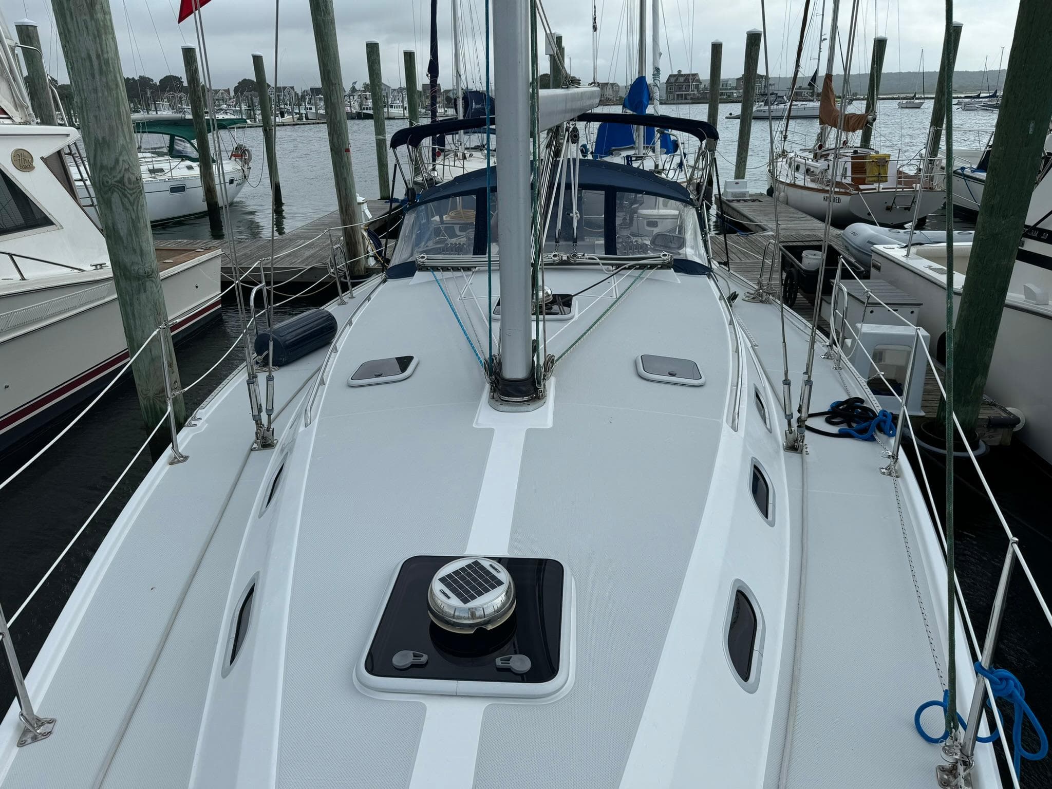 2004 Catalina 42 MkII sailboat docked at marina, view of deck and mast.
