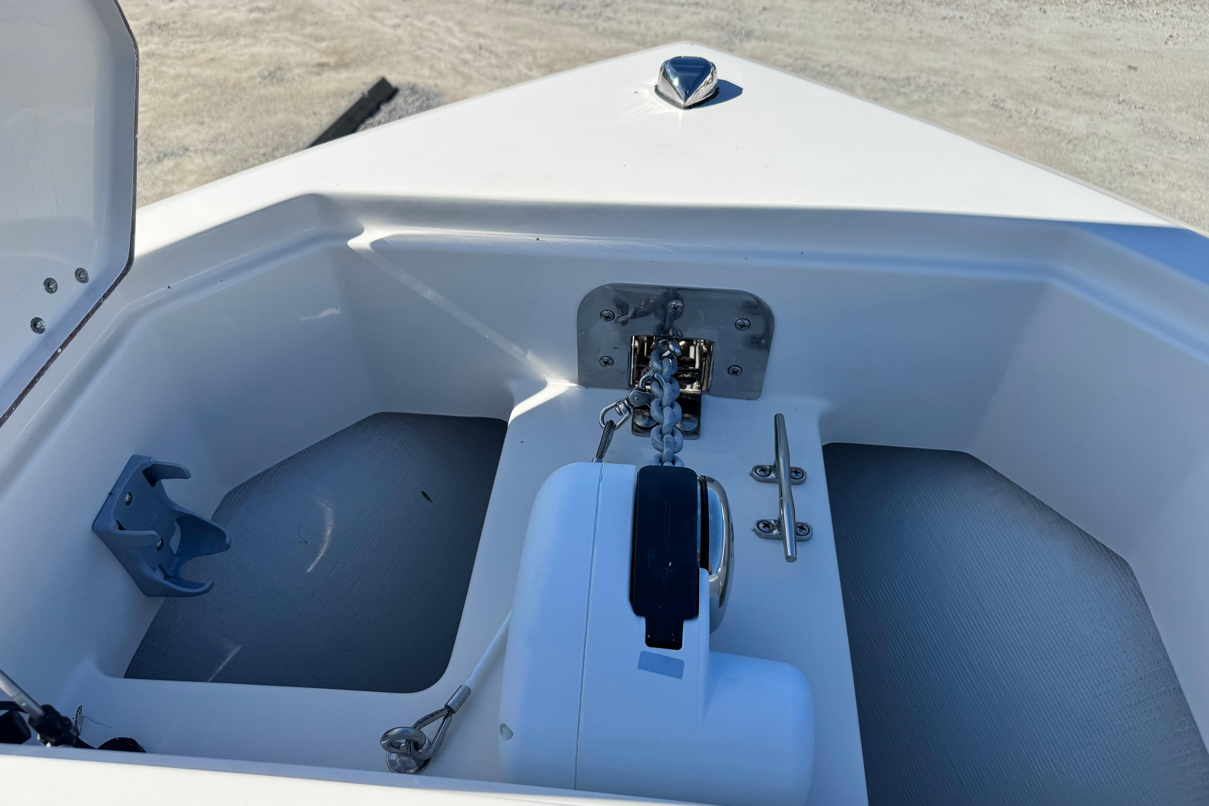 Anchor compartment of 2026 Sailfish 272 CC boat, featuring chain and cleat.