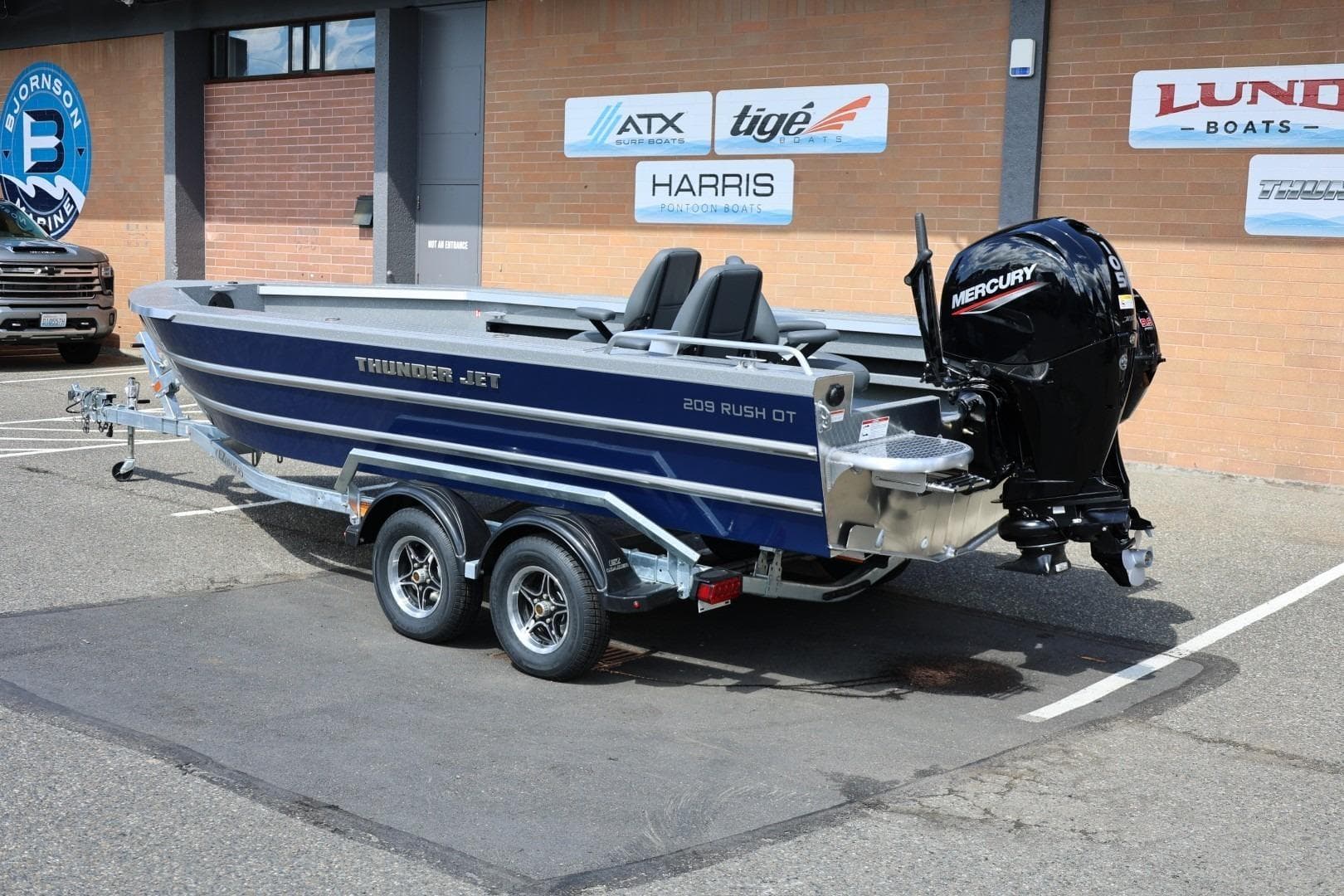 2026 Thunder Jet 209 Rush OT boat with Mercury outboard motor on trailer.