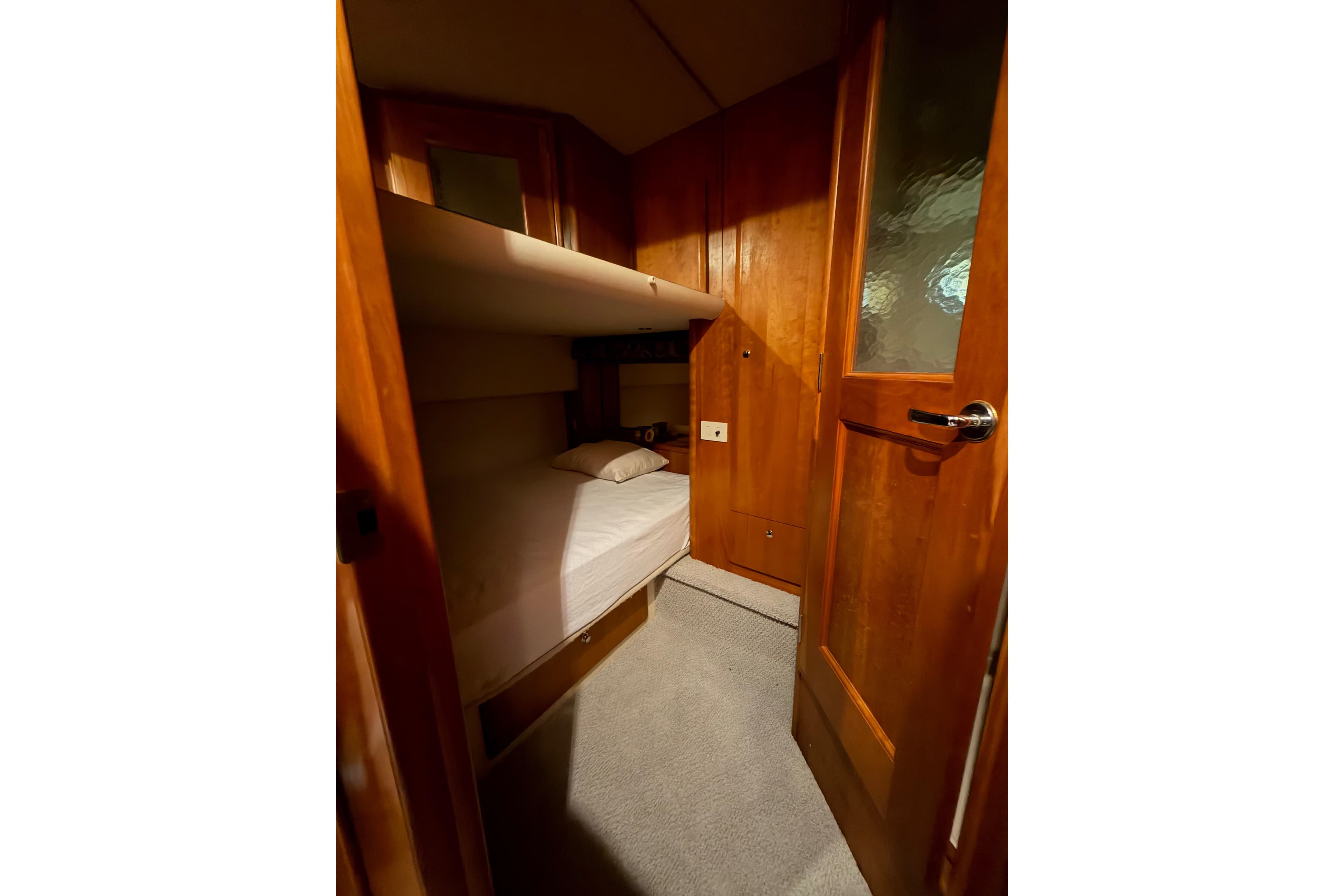 Interior cabin of 2001 Silverton 410 Sport Bridge with wooden finishes and bunk beds.