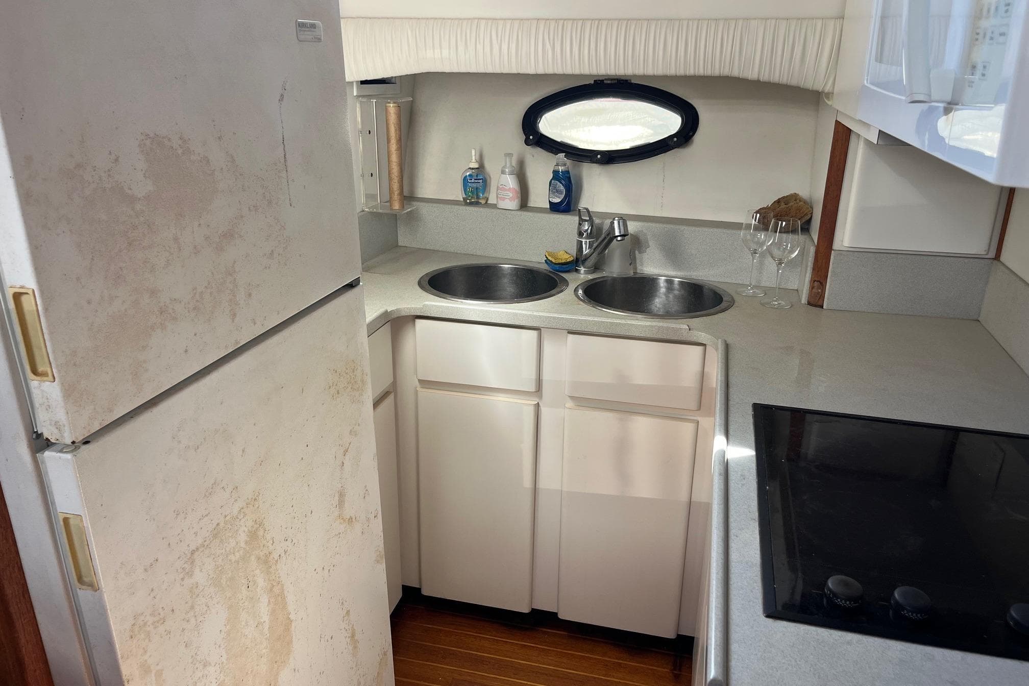 1990 Californian 52 Cockpit Motor Yacht kitchen with dual sinks and appliances.