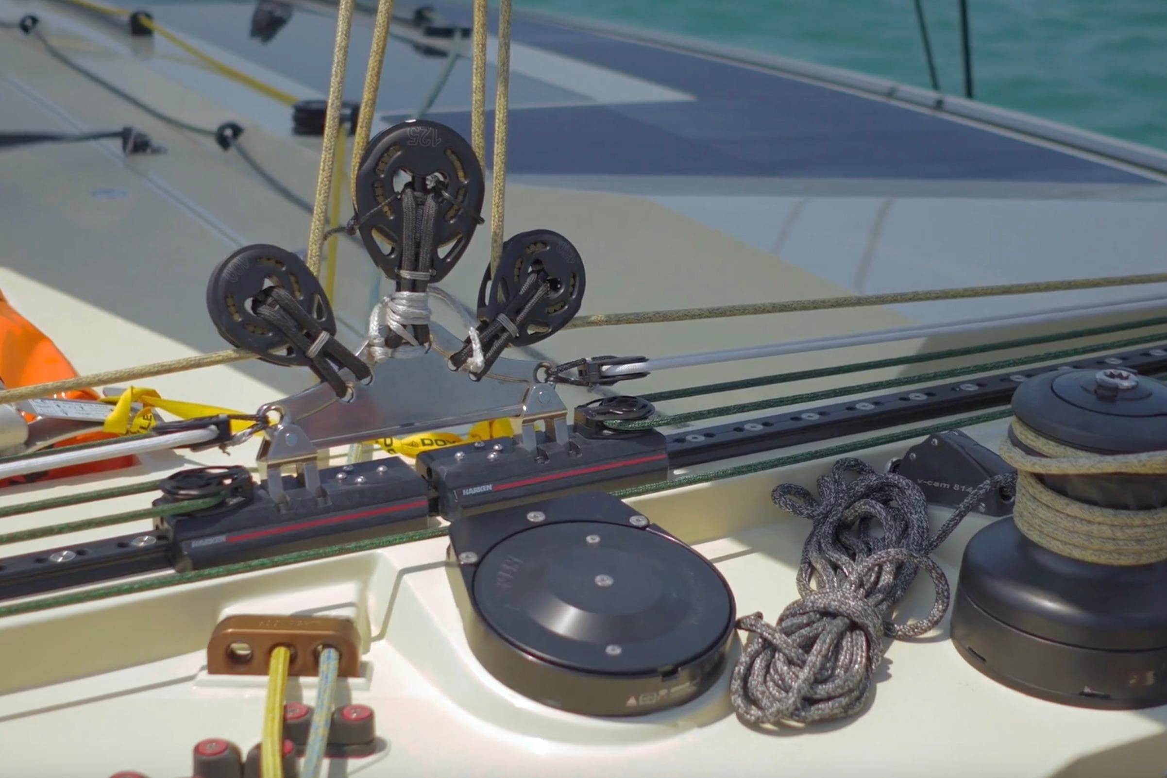 Close-up of 2023 McConaghy MC75 yacht deck with rigging and winch details.