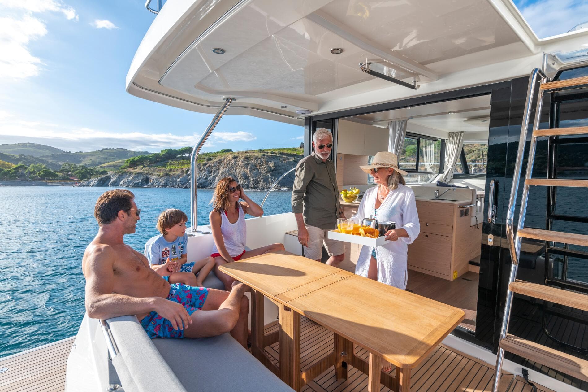 People enjoying leisure time on a 2025 Beneteau Swift Trawler 41 Fly yacht.