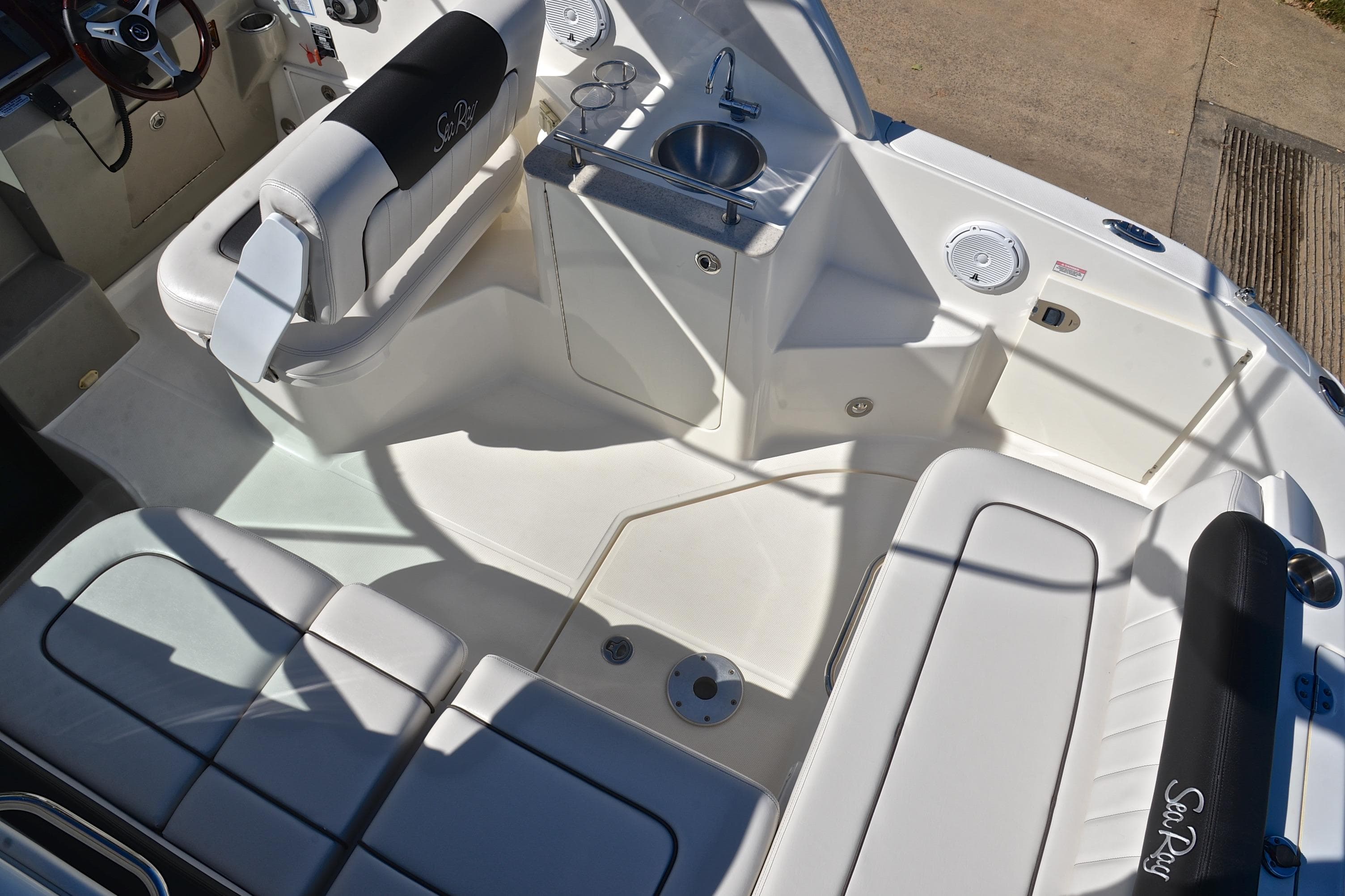 2011 Sea Ray 260 Sundancer boat interior with seating and sink.
