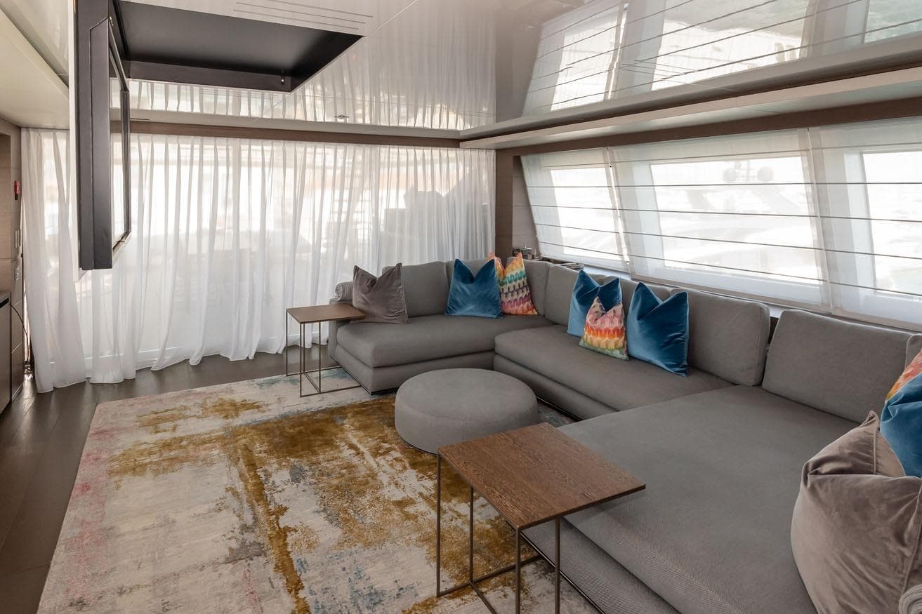 Luxurious 2018 FERETTI Navetta 37 yacht interior with modern seating and vibrant cushions.