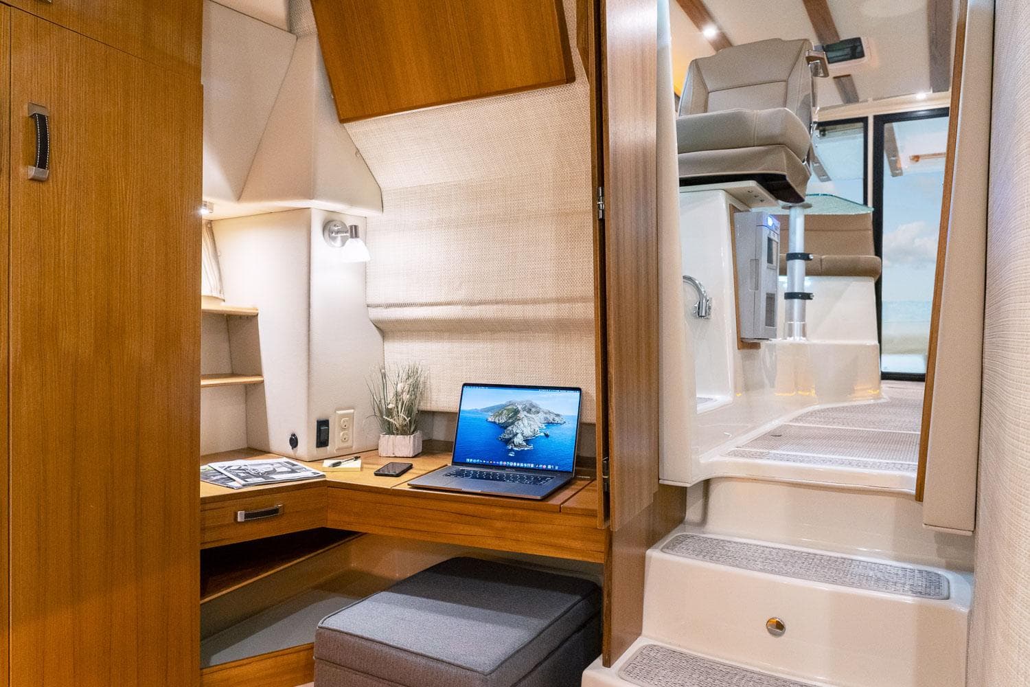 2025 Ranger Tugs R-43 S interior with modern workspace and stairs.