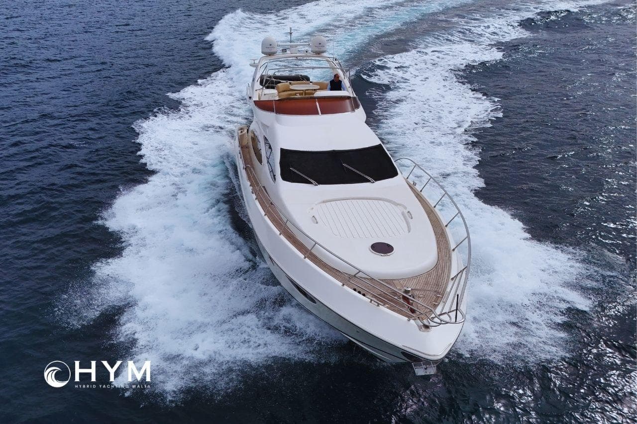 Luxurious 2007 Azimut 68E yacht cruising on open water, showcasing sleek design and elegance.