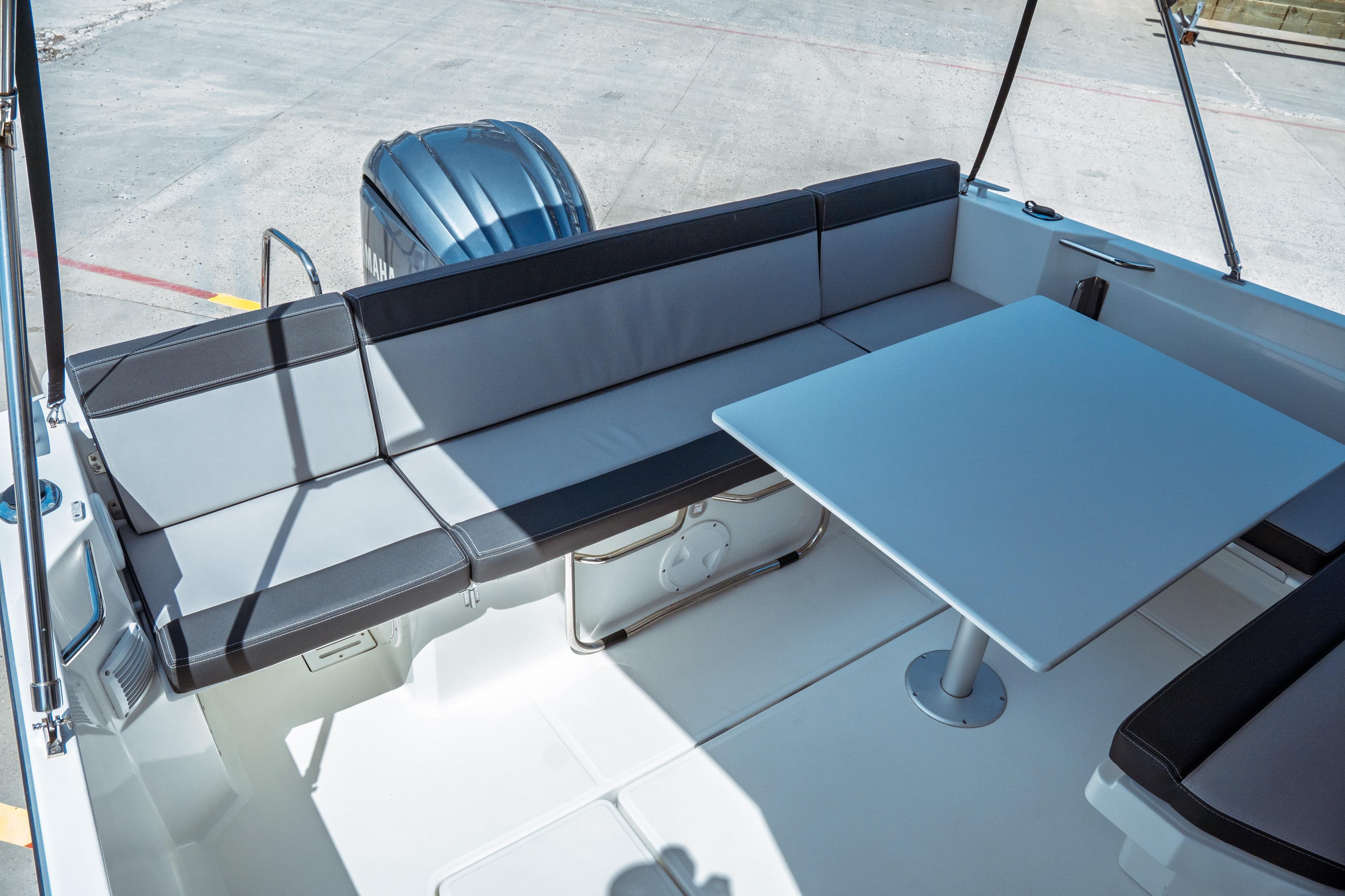 2023 Jeanneau NC Weekender 795 Series 2 boat interior with seating and table.