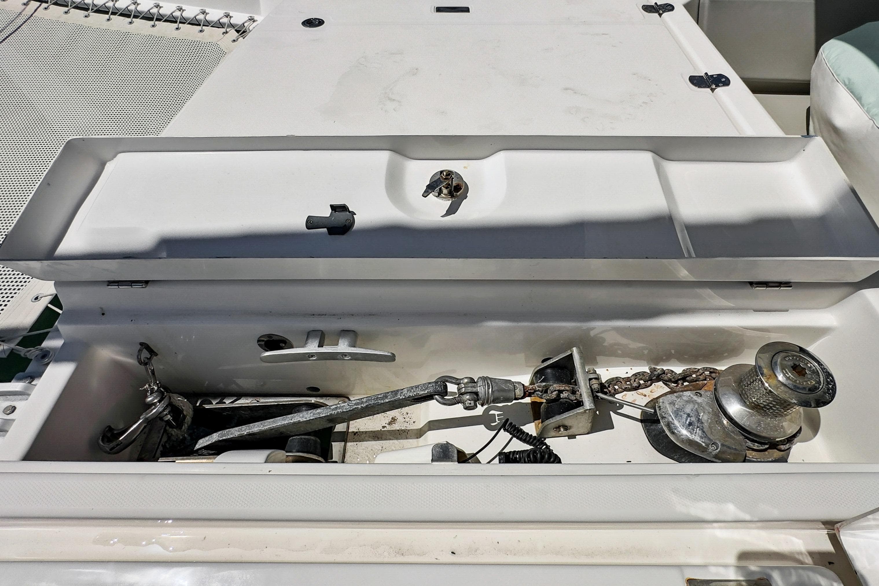 Anchor compartment of 2021 Leopard 45 catamaran with winch and chain.