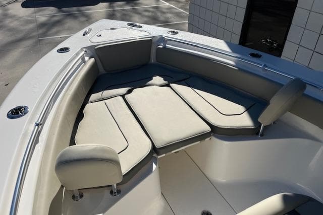 2026 Key West 239 FS boat with cushioned seating in the bow area.