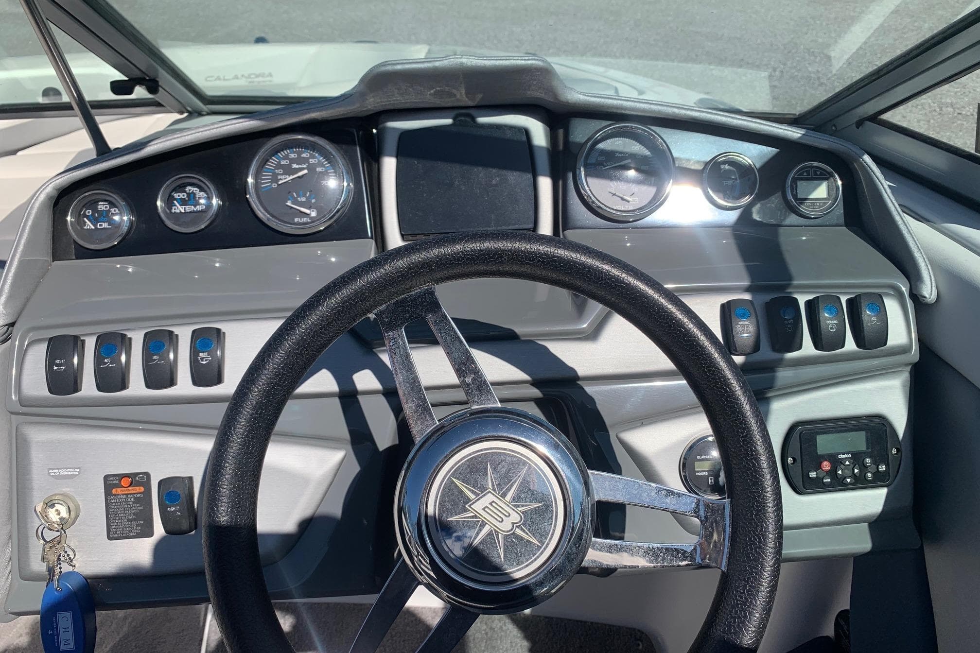 Dashboard of a 2015 Bryant Calandra boat with steering wheel and gauges.