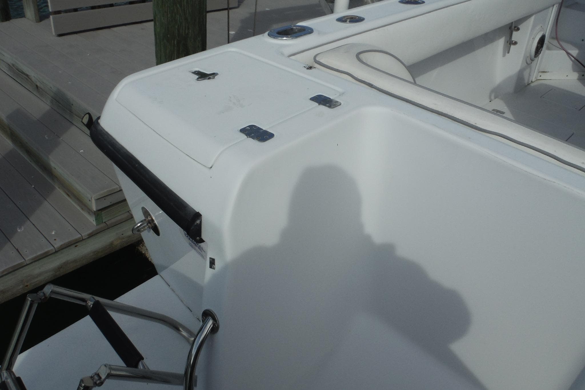 1999 Intrepid 289 Center Console boat interior with seating and storage compartments.