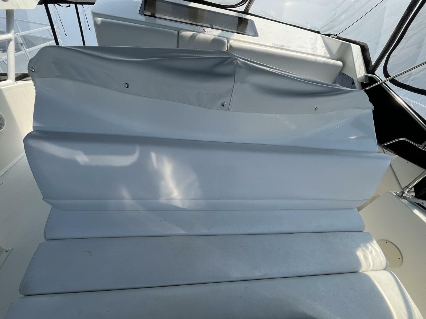 1996 Silverton 372 Signature boat interior seating with white upholstery and sleek design.