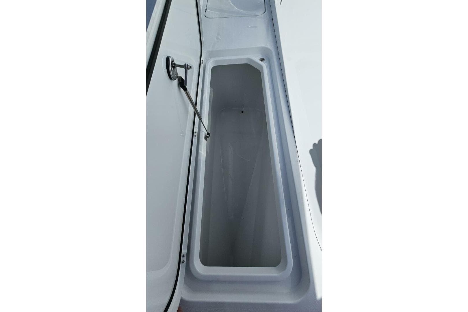 Open storage compartment on 2025 Costa Custom Boats 34ST.
