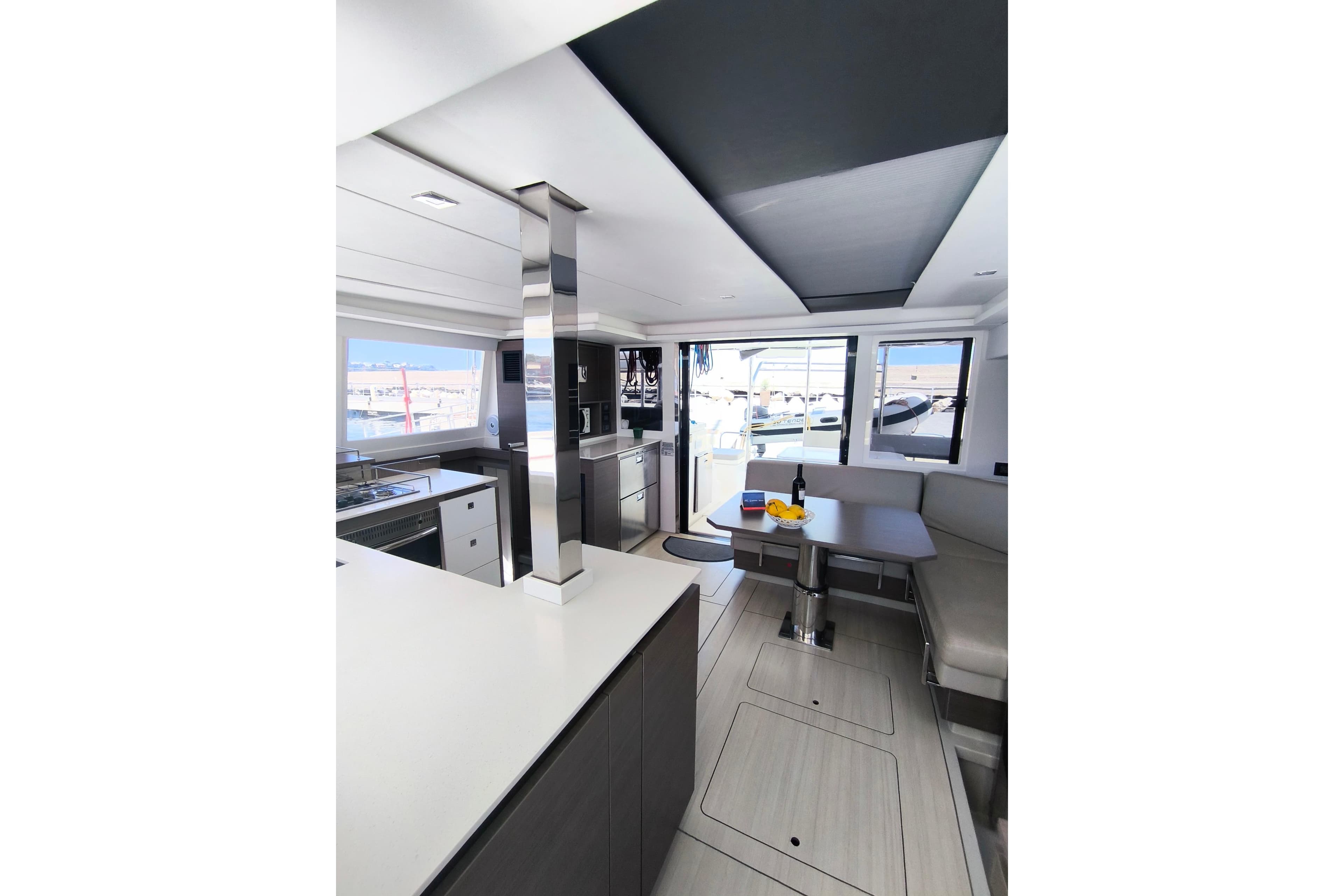 Modern interior of 2021 Leopard 42 yacht with sleek kitchen and seating area.