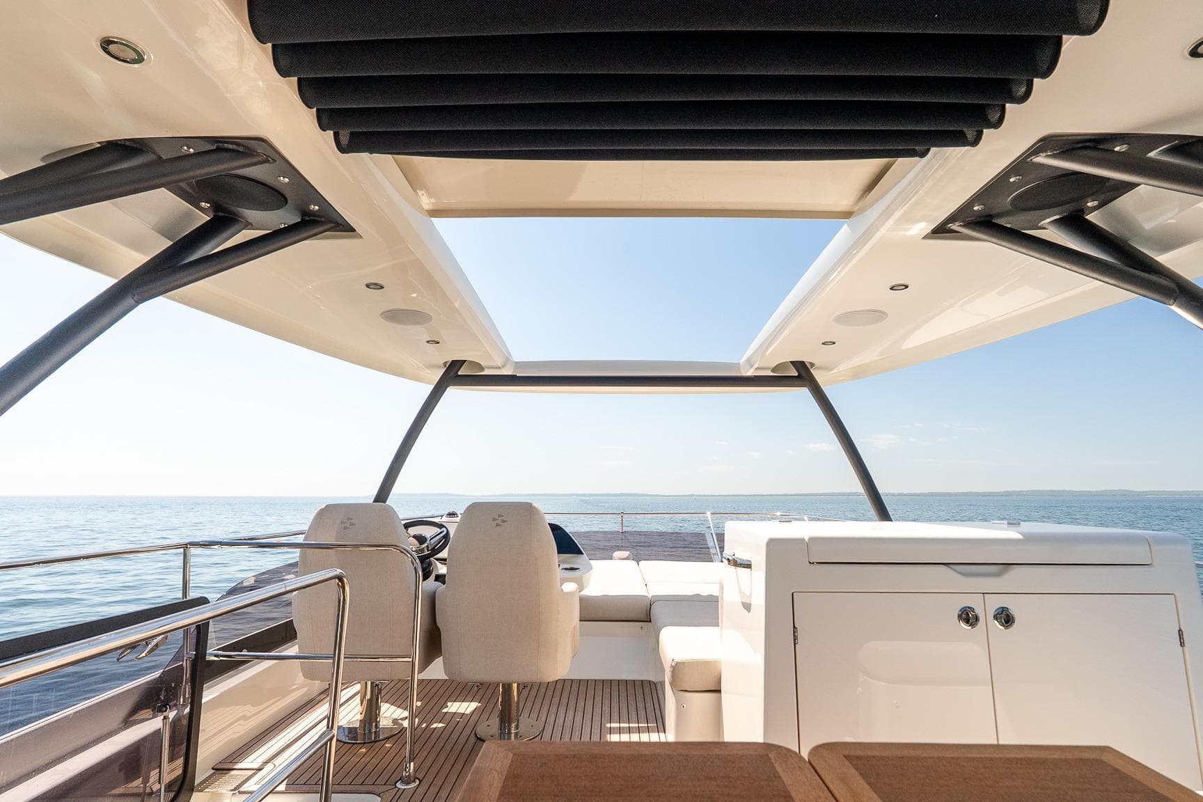 Luxurious 2026 Prestige F5.7 yacht interior with open deck and ocean view.