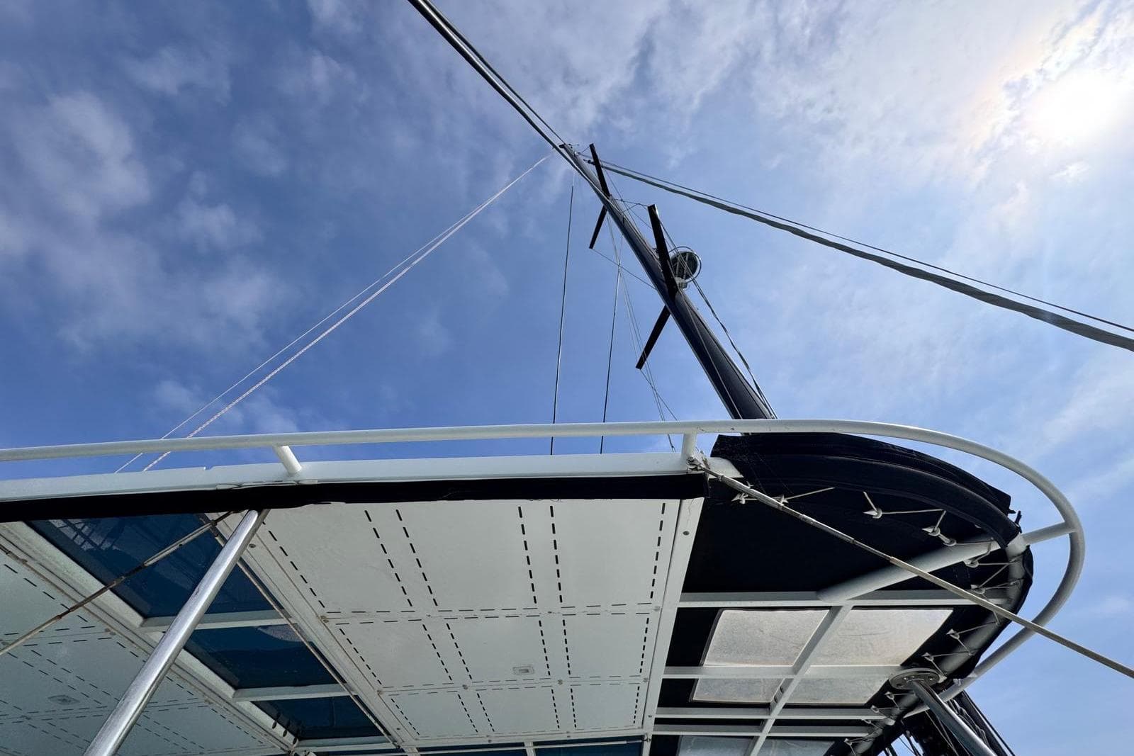 Lagoon 52 F catamaran mast and deck against a clear blue sky, 2021 model.