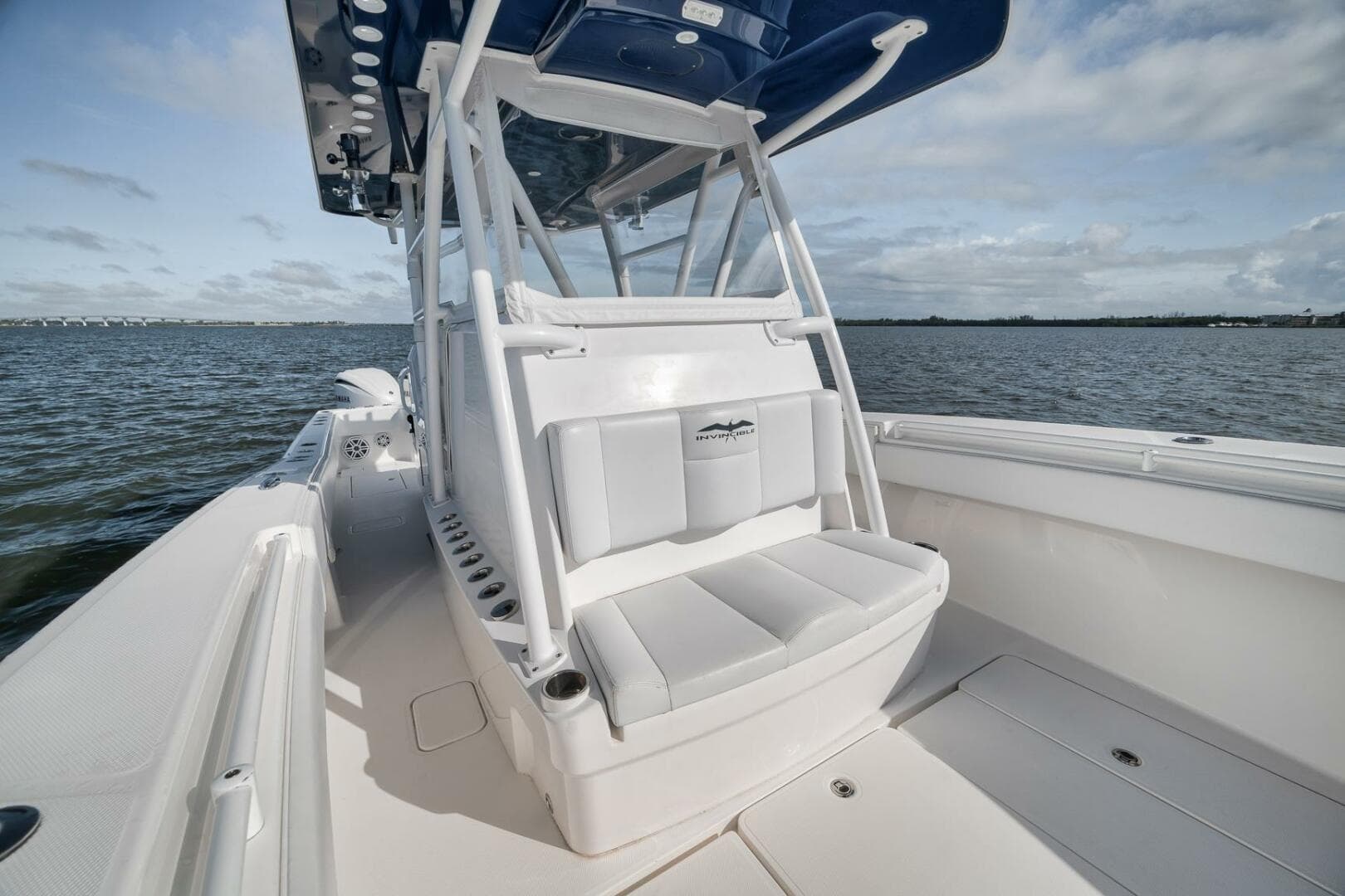 2018 Invincible 36' Open Fisherman boat on water, showcasing seating and console.