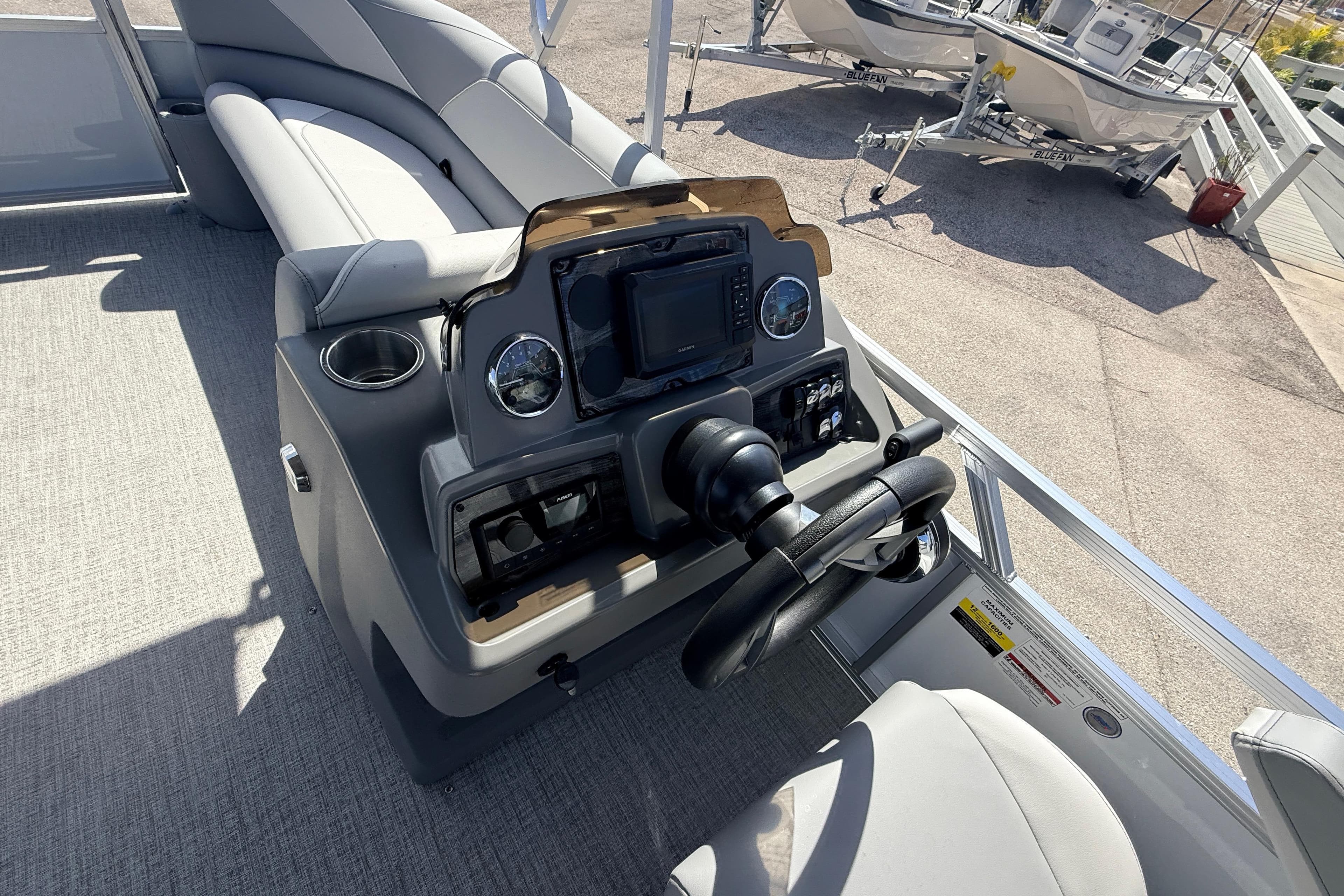 2026 Avalon 2385 Venture 85 VRB boat dashboard with steering wheel and controls.