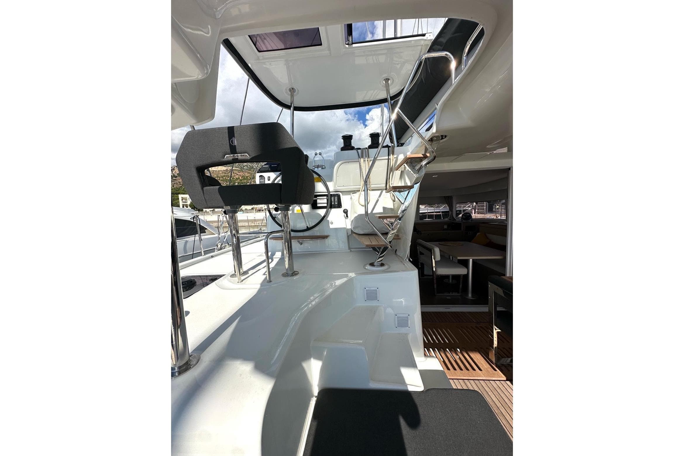 2025 Lagoon 43 yacht interior with modern helm and seating area.