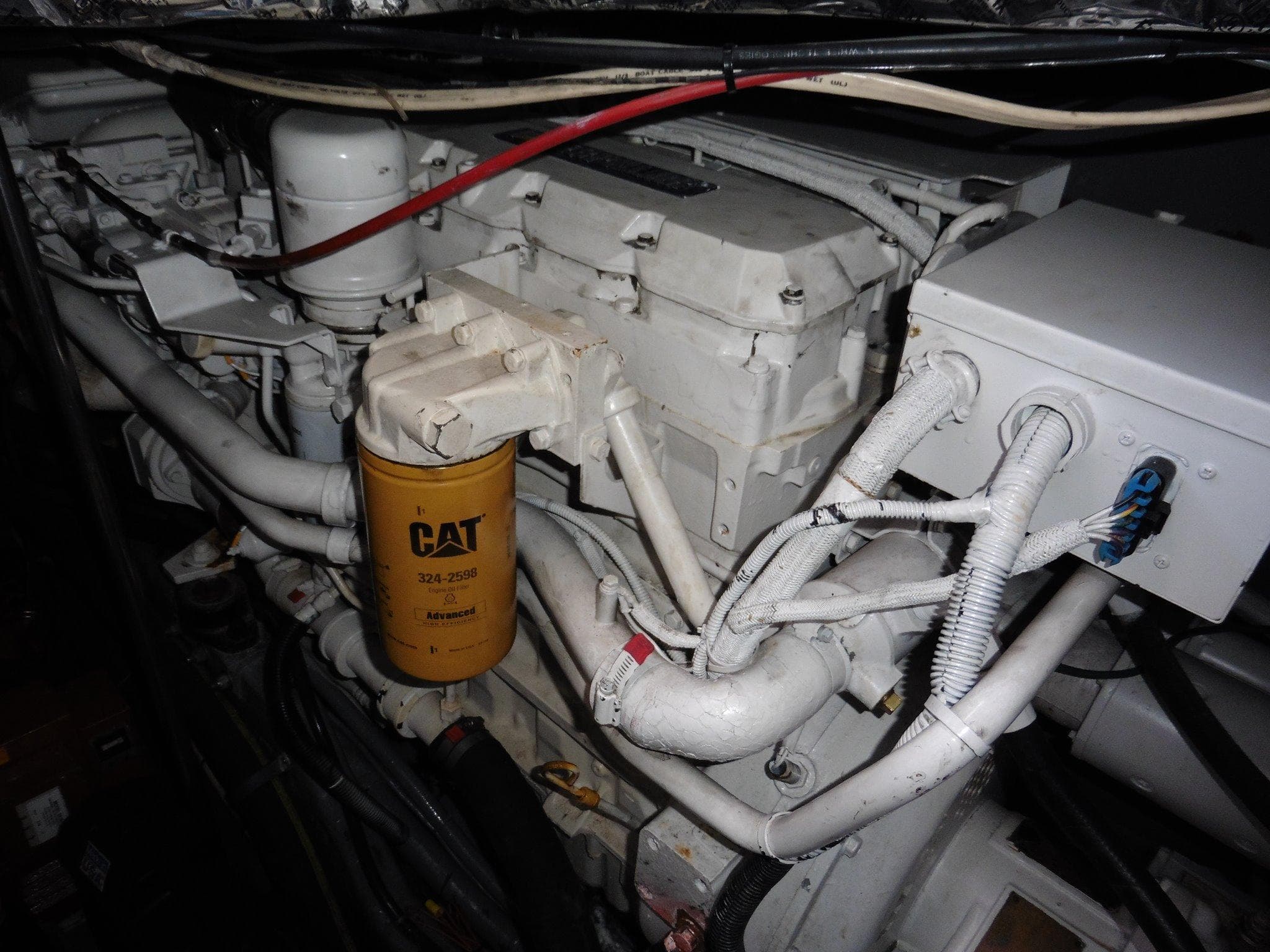 Engine compartment of 1997 Sea Ray 440 Express Bridge with CAT filter visible.