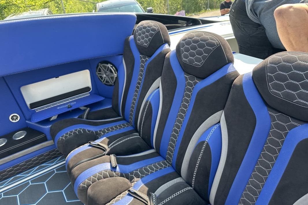 Luxurious blue and black interior of 2018 Wright Performance 420 boat with hexagonal patterns.