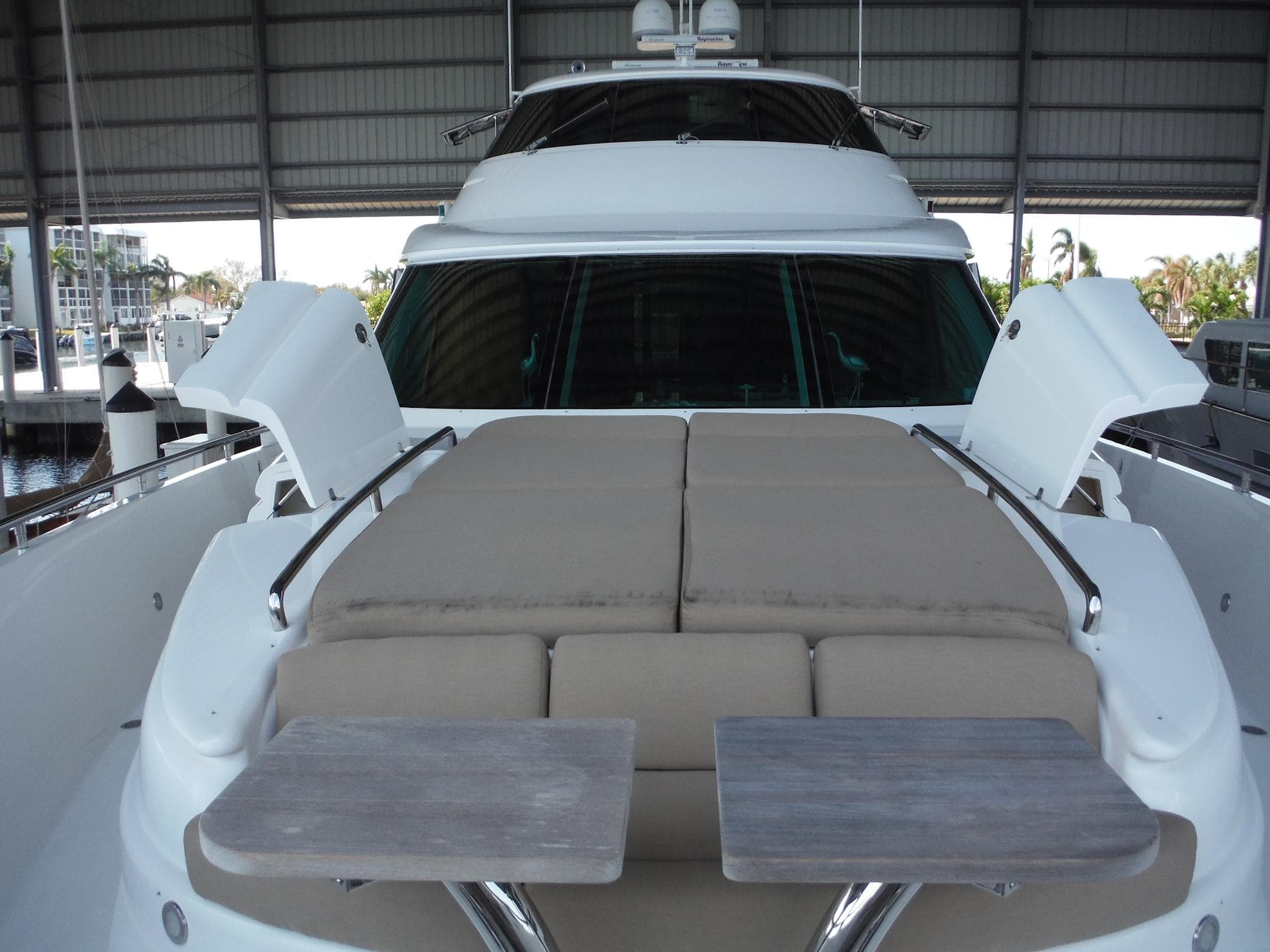 2015 Horizon E88 luxury yacht with sun deck and tables.