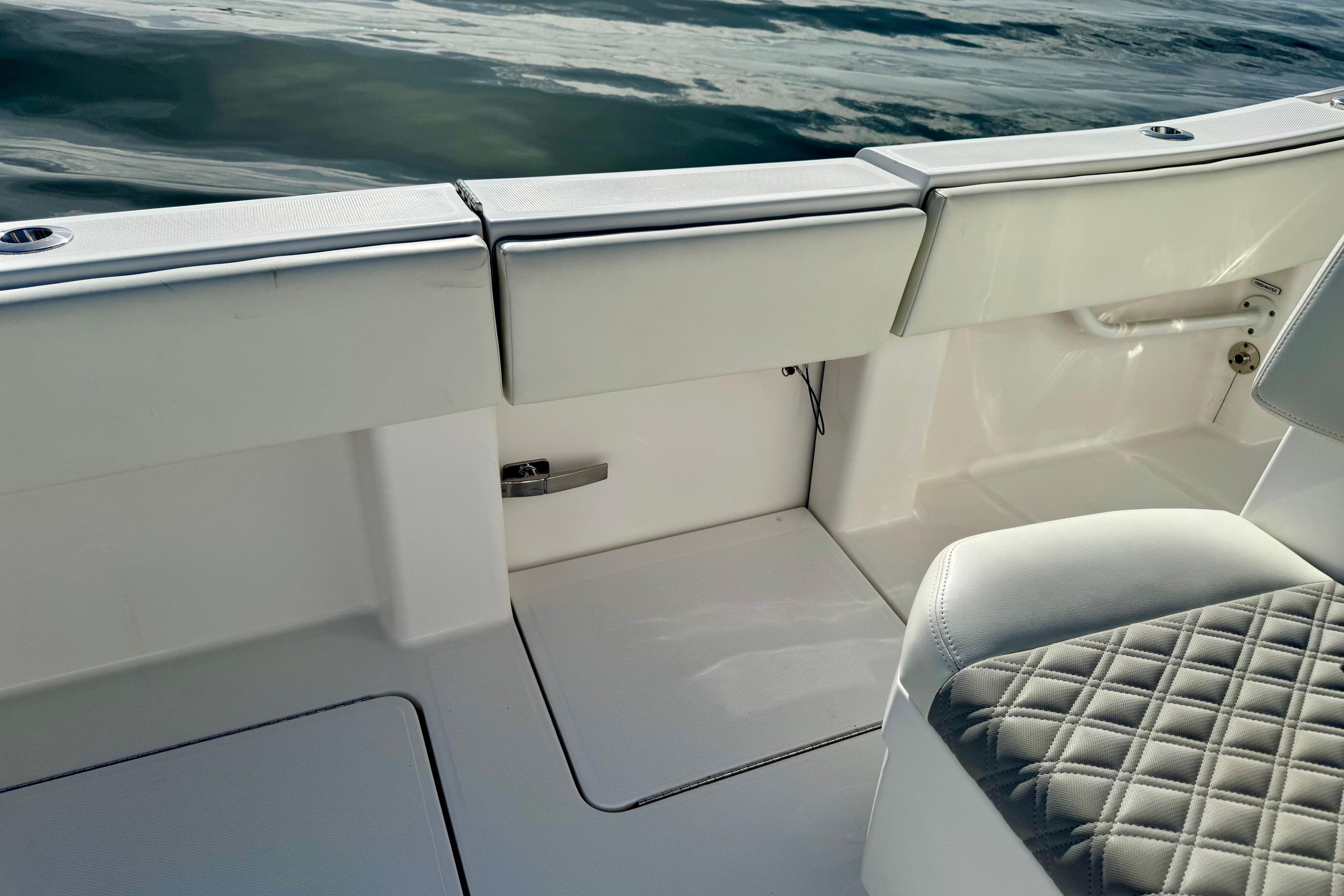 2024 Invincible 39 Open Fisherman boat interior with cushioned seating and sleek design.