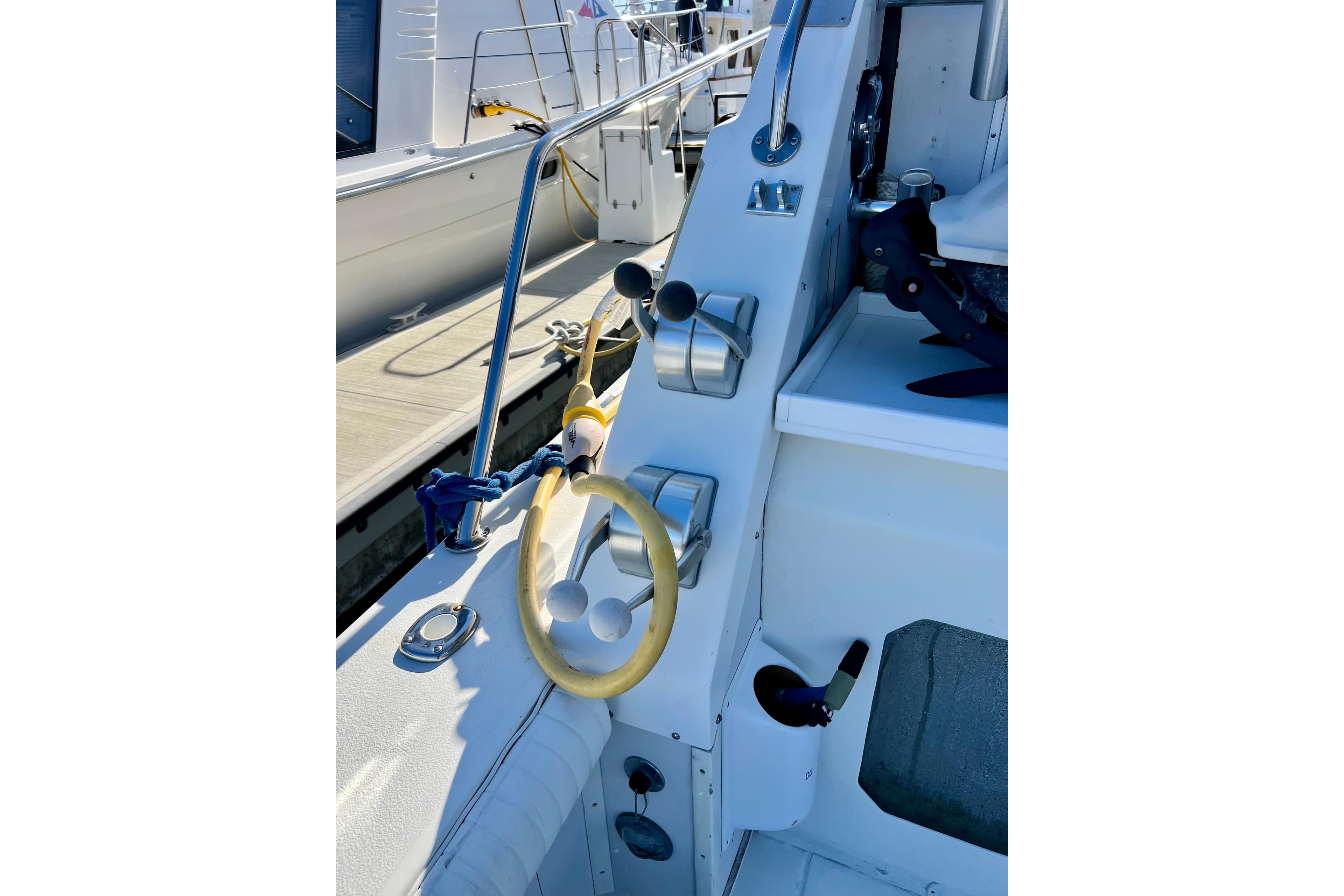 1982 Bertram 46 Convertible yacht helm with steering wheel and controls.