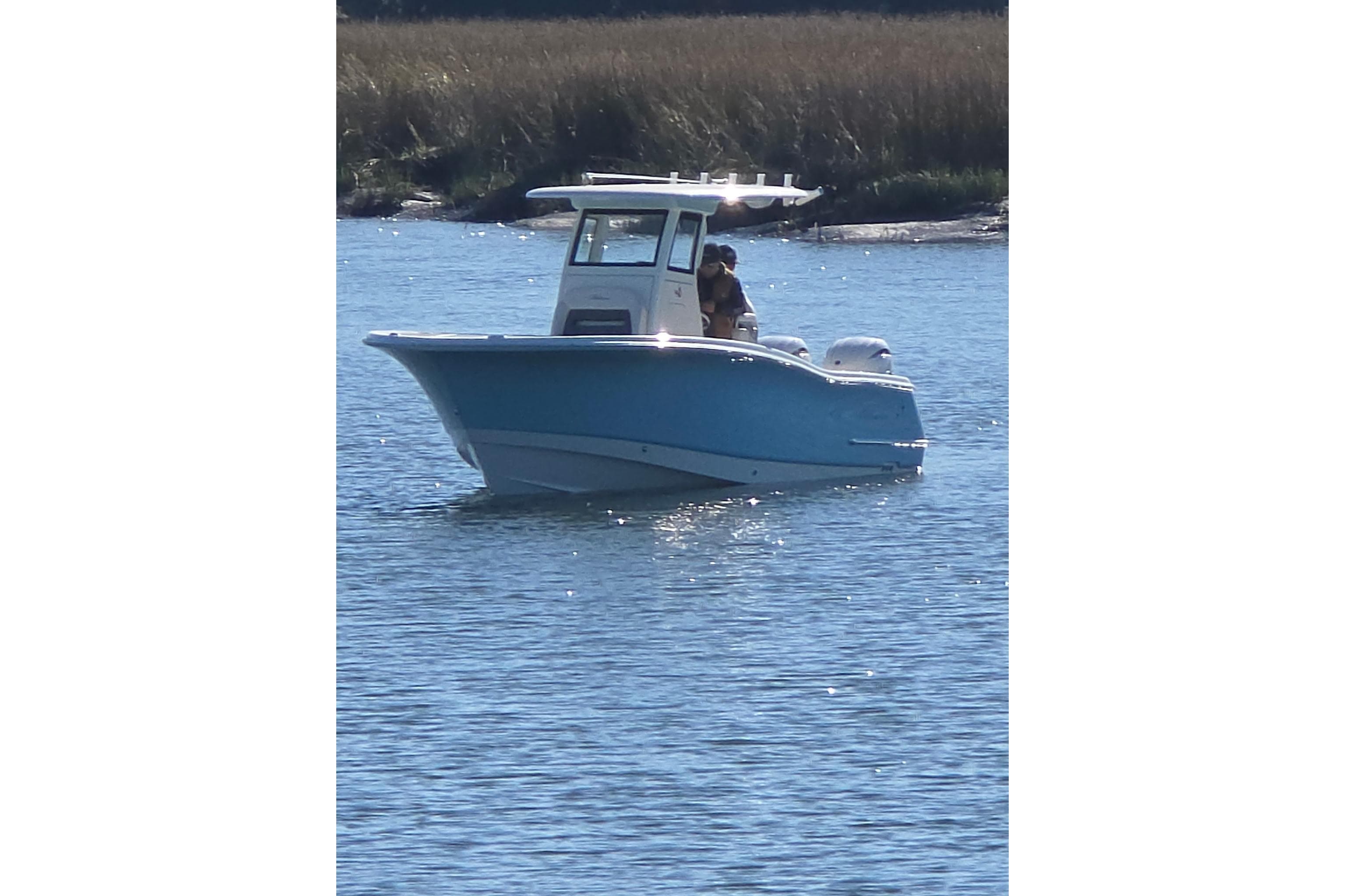 2026 Pioneer boat on calm water, featuring a sleek blue hull and modern design.