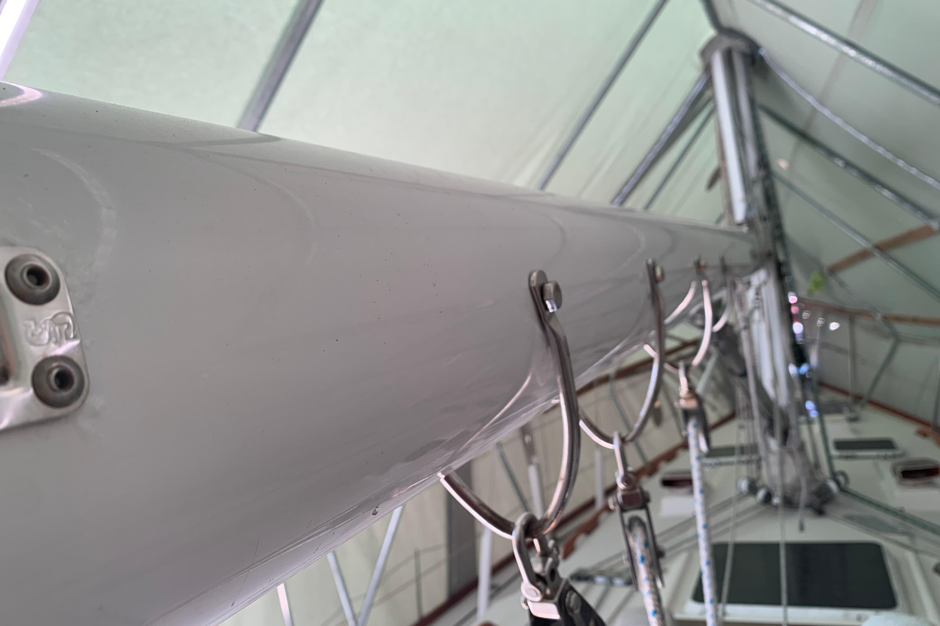 Close-up of a 1984 Sabre 38 sailboat mast with rigging details.