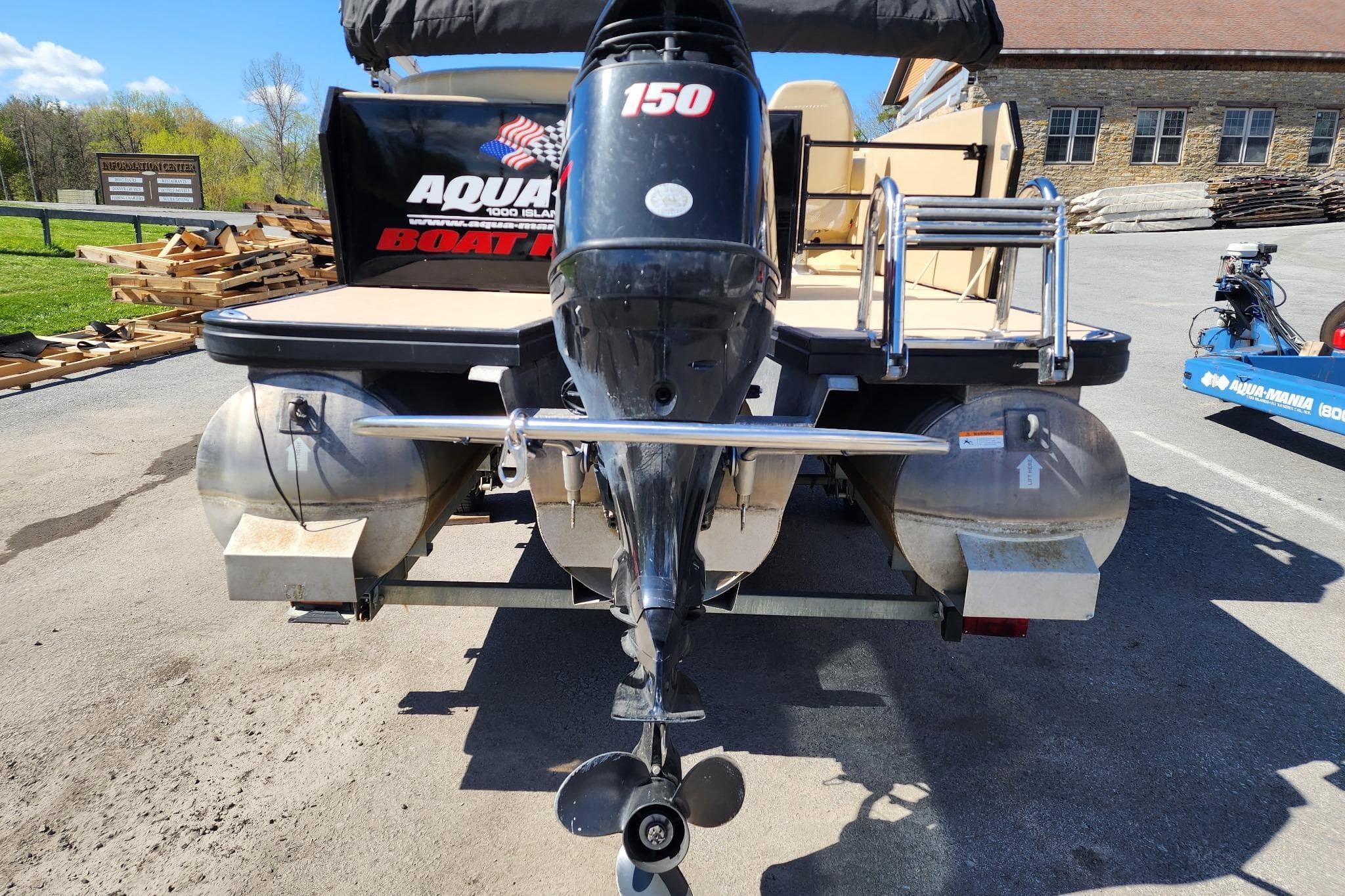 2017 Larson Escape RT 2400 Cruise Triple pontoon boat with 150 HP outboard motor.
