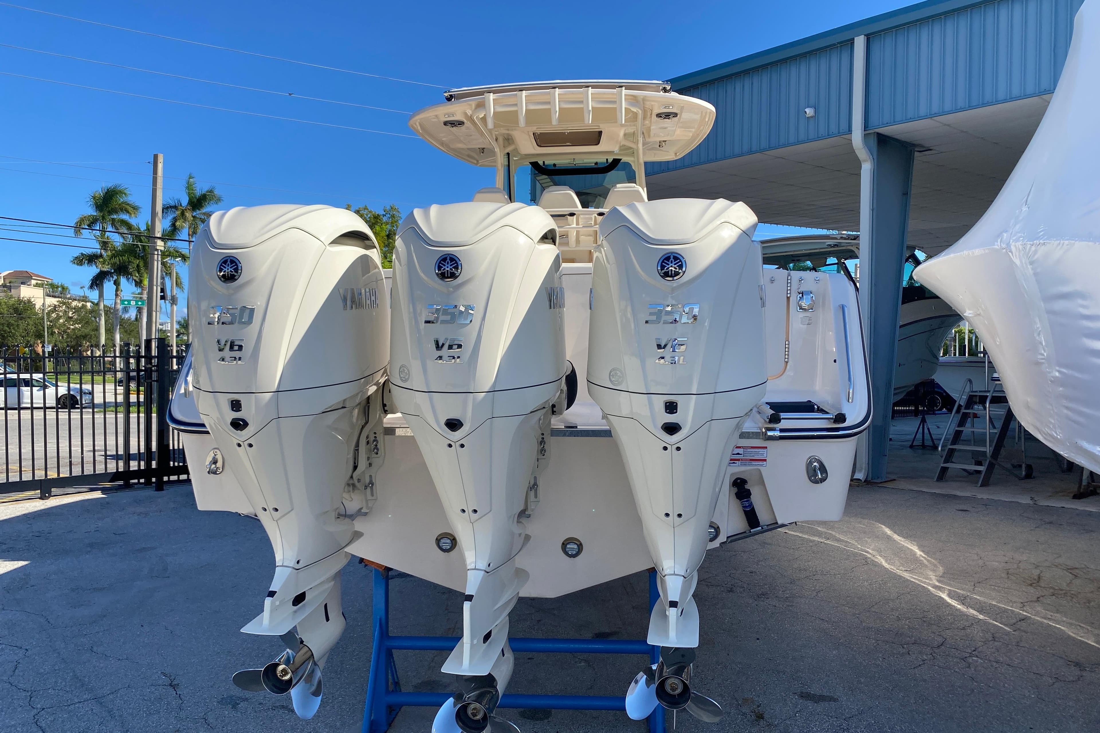 2026 Grady-White Canyon 336 boat with triple Yamaha V6 outboard engines.