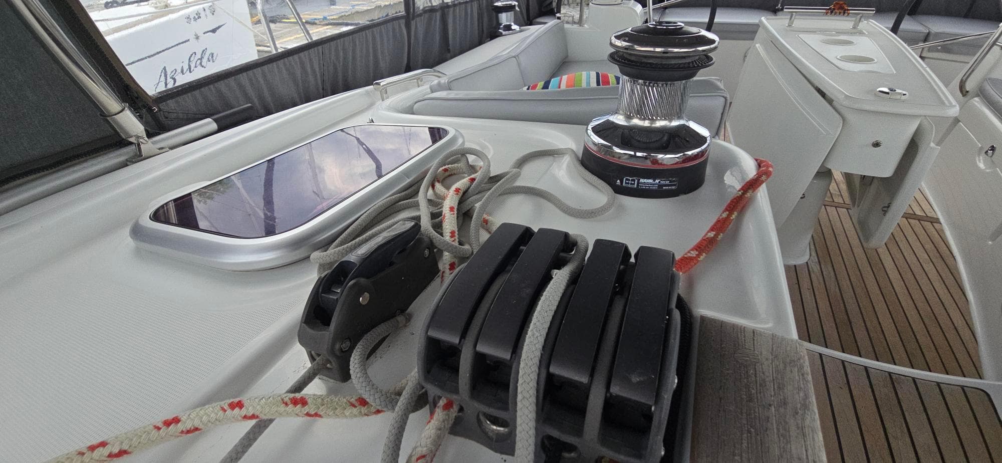 Deck view of 2011 Beneteau Oceanis 46 sailboat, featuring winch and rope system.