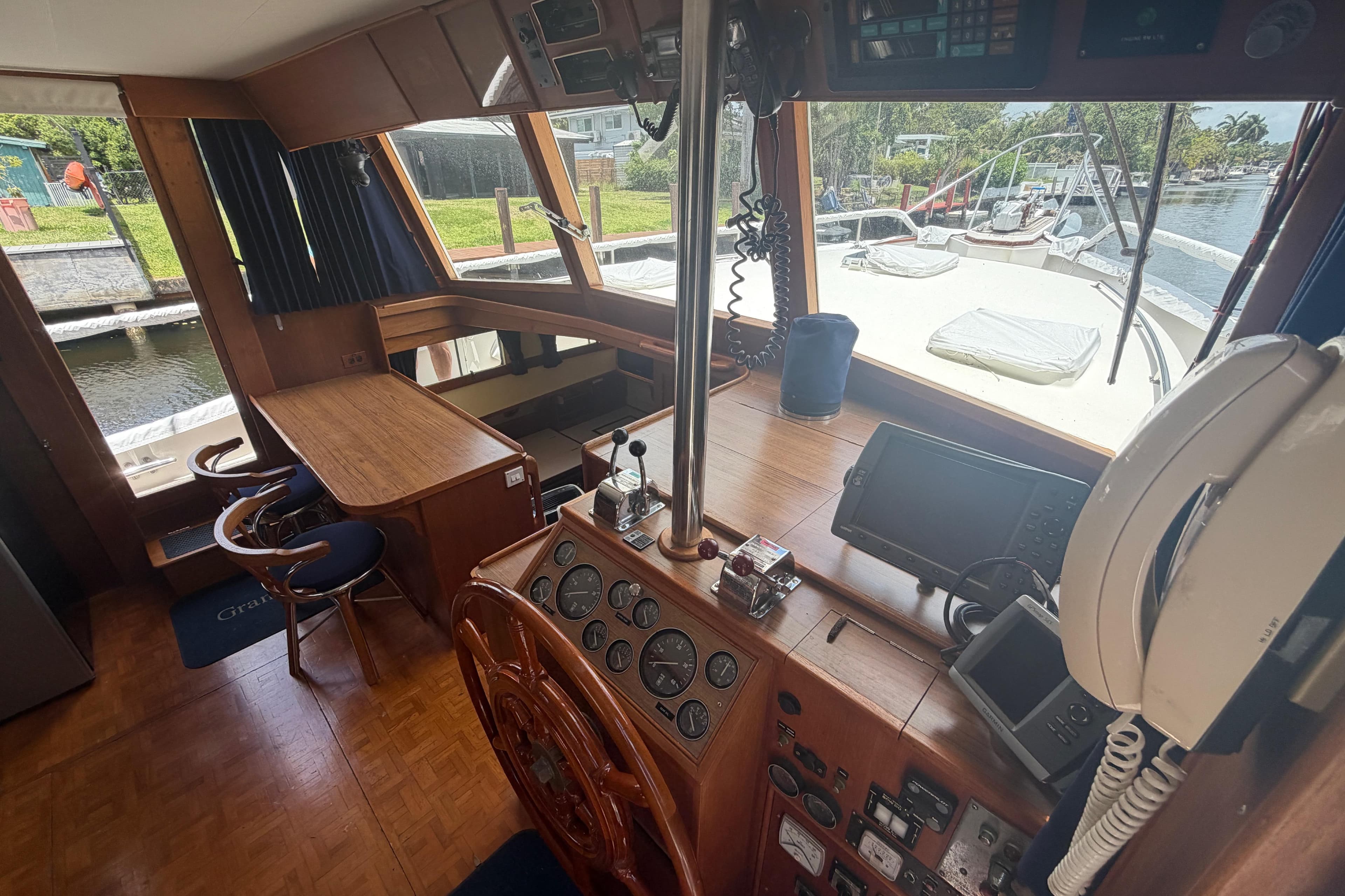 Interior of 1991 Grand Banks 46 Classic yacht with helm, navigation equipment, and seating area.