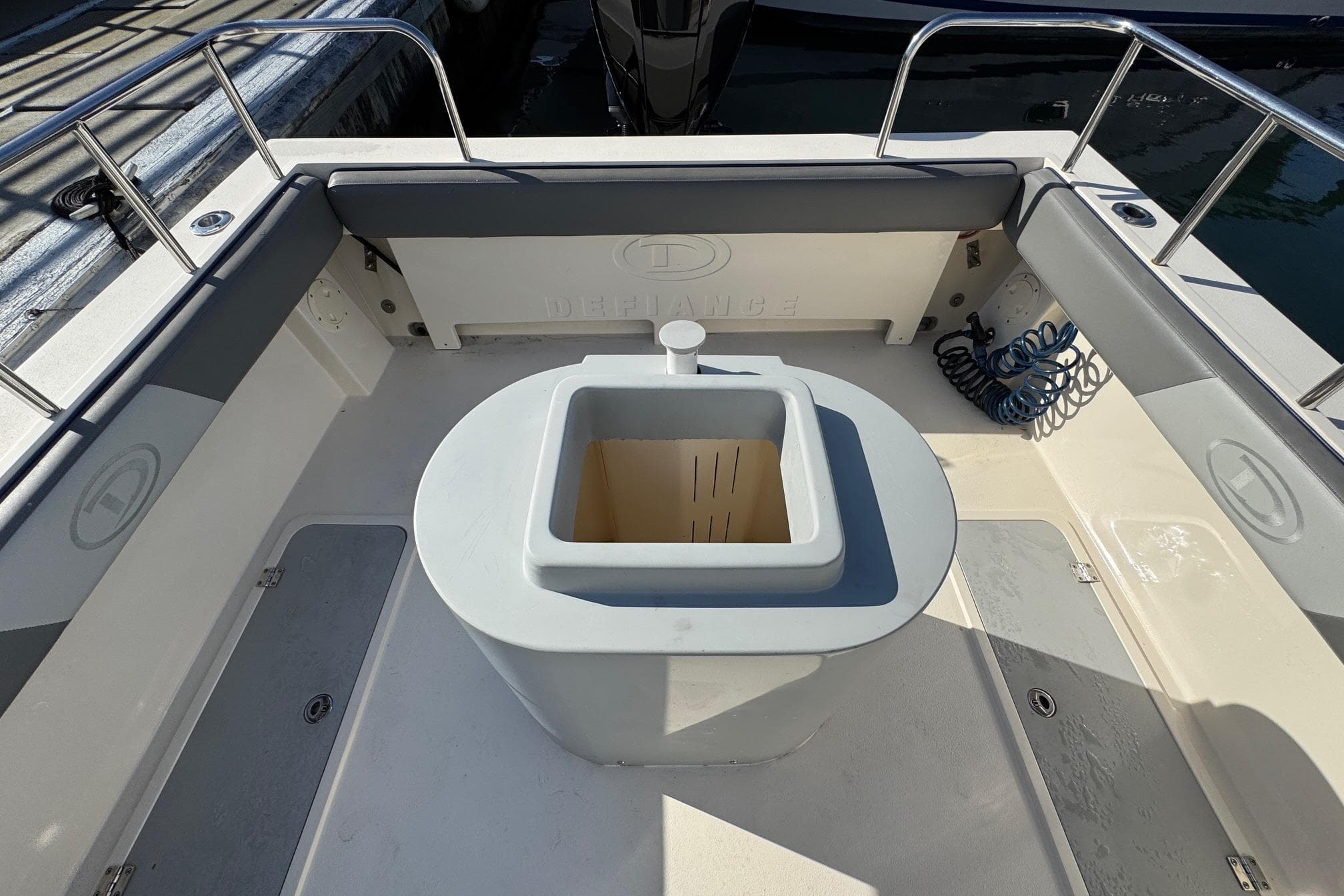 2023 Defiance Admiral 220 EX boat interior with seating and storage.