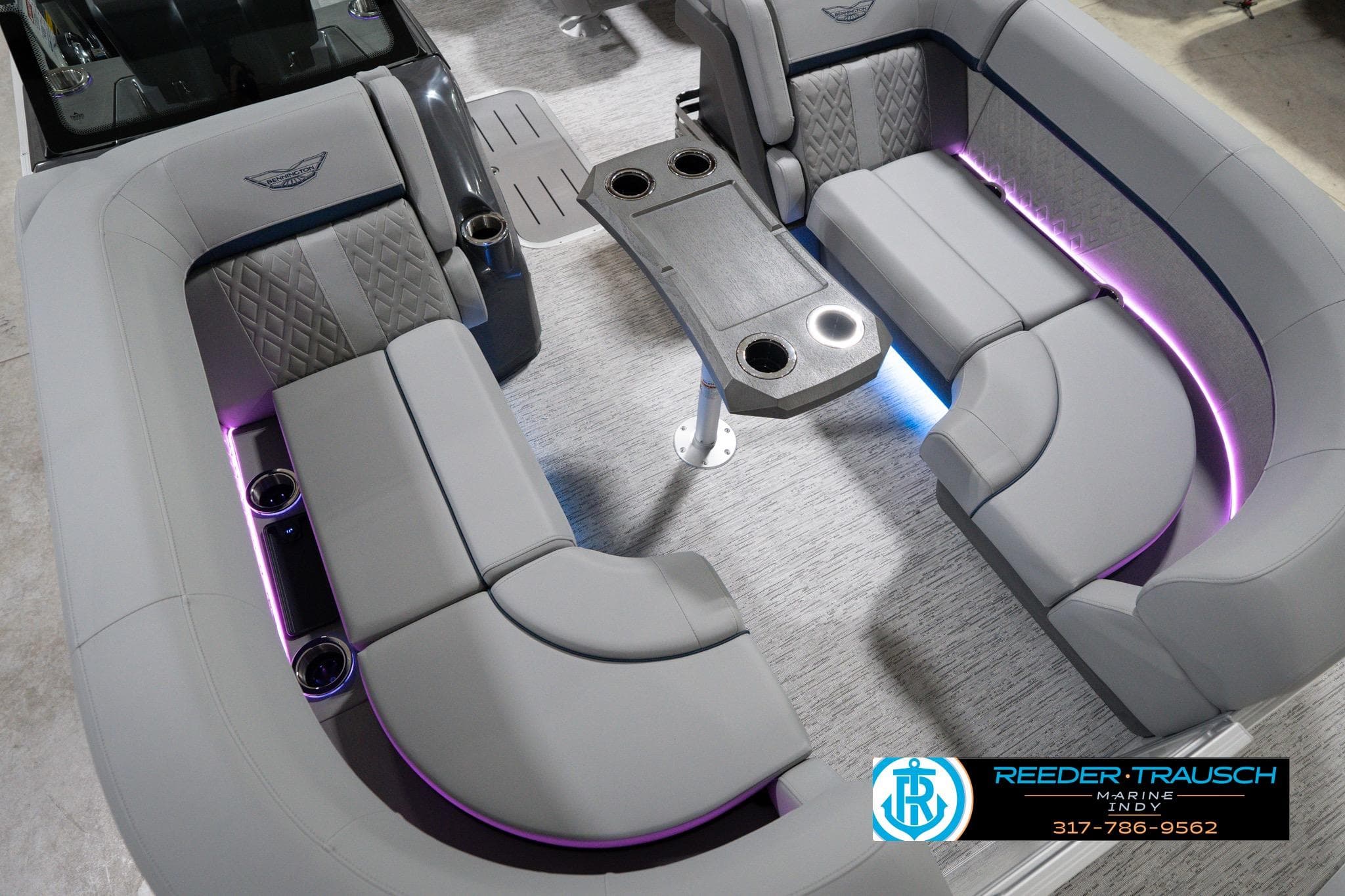 Luxurious interior of 2026 Bennington 22 MFB pontoon boat with ambient lighting.