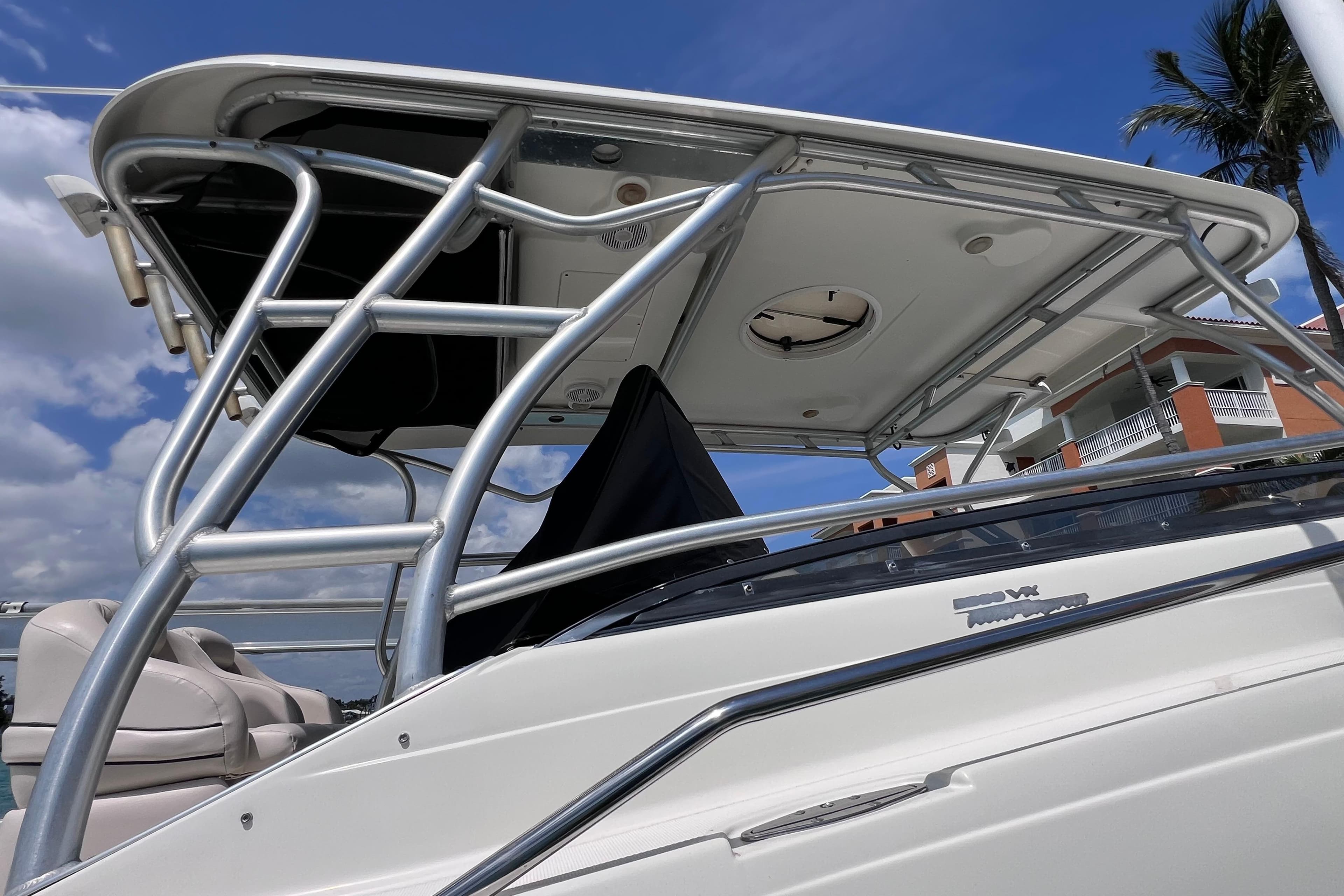 2005 Hydra-Sports Vector 3300 VX boat with T-top, under clear blue sky.