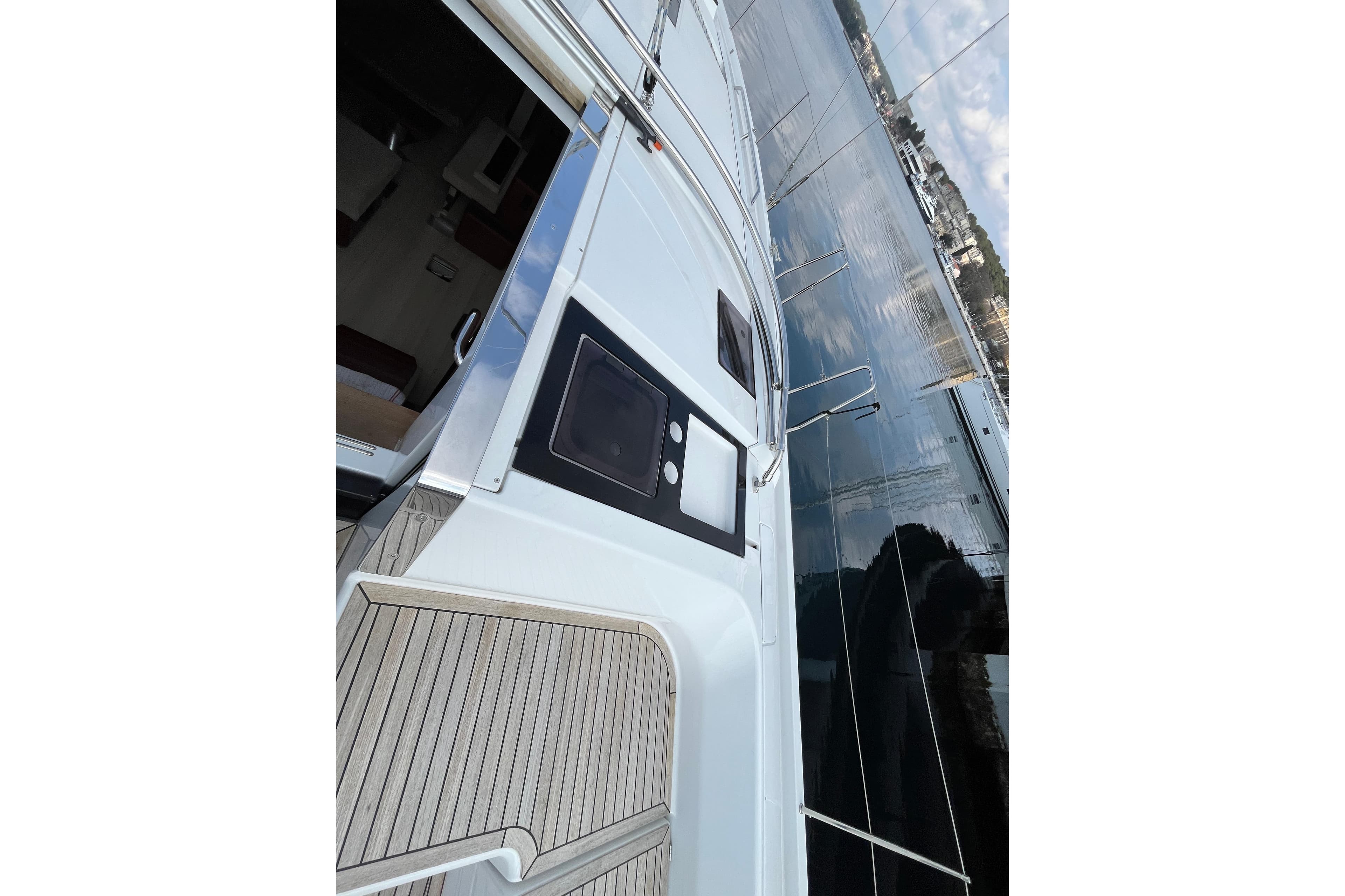 2024 Hanse 460 yacht deck with sleek design and waterfront view.