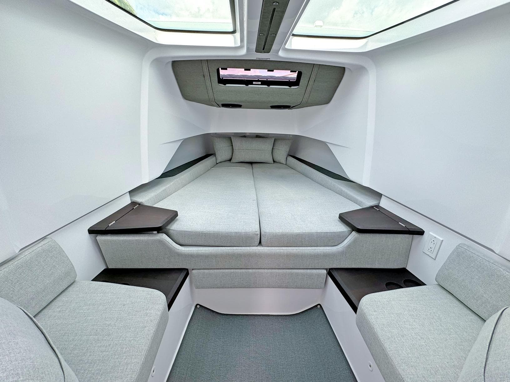 2024 Axopar 37XC CROSS CABIN interior with modern, spacious sleeping area and skylights.