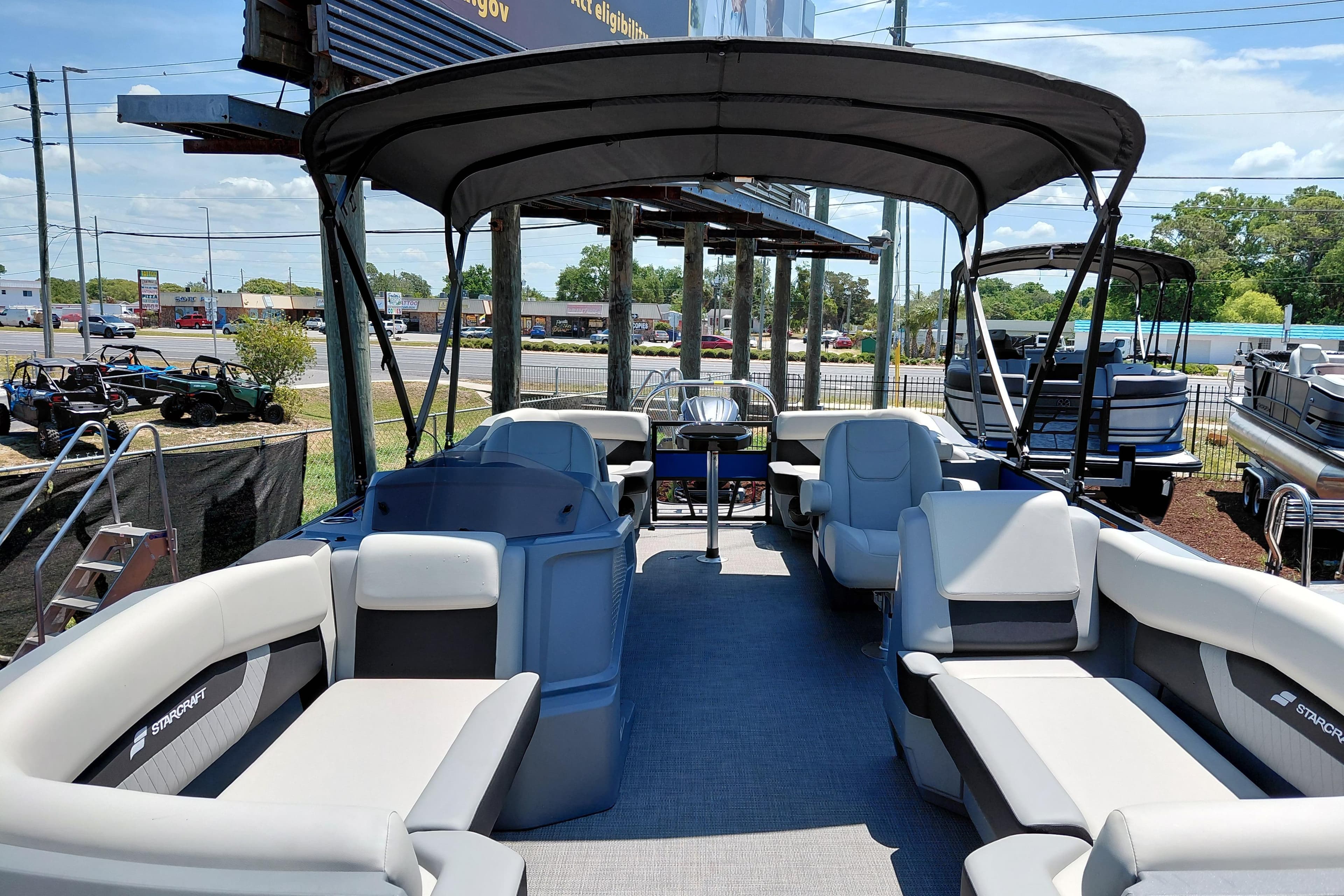 2026 Starcraft VX 22 R DH pontoon boat with spacious seating and canopy, displayed outdoors.