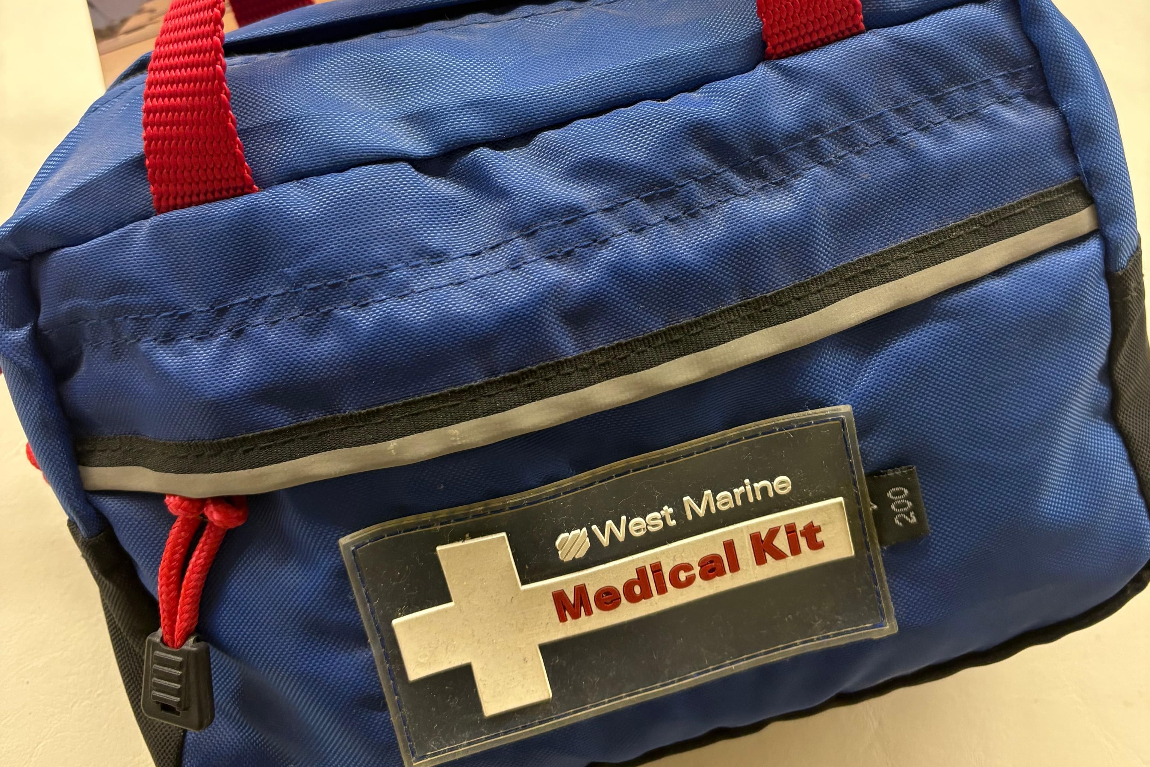 Blue West Marine medical kit bag with red handles, suitable for Sea Ray 340 Sundancer 2000.