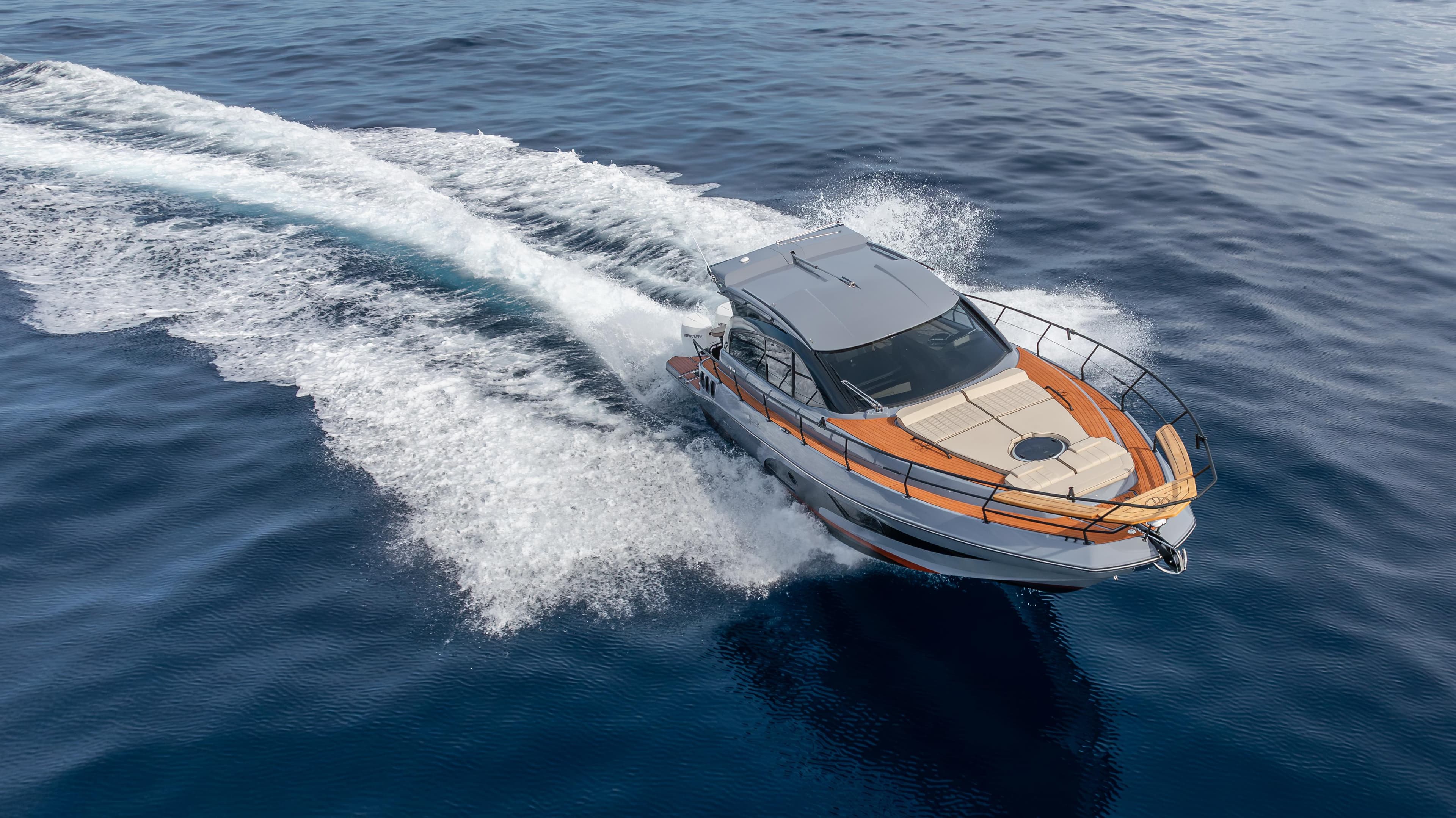 2025 Hanover 415 boat cruising on open water, aerial view.