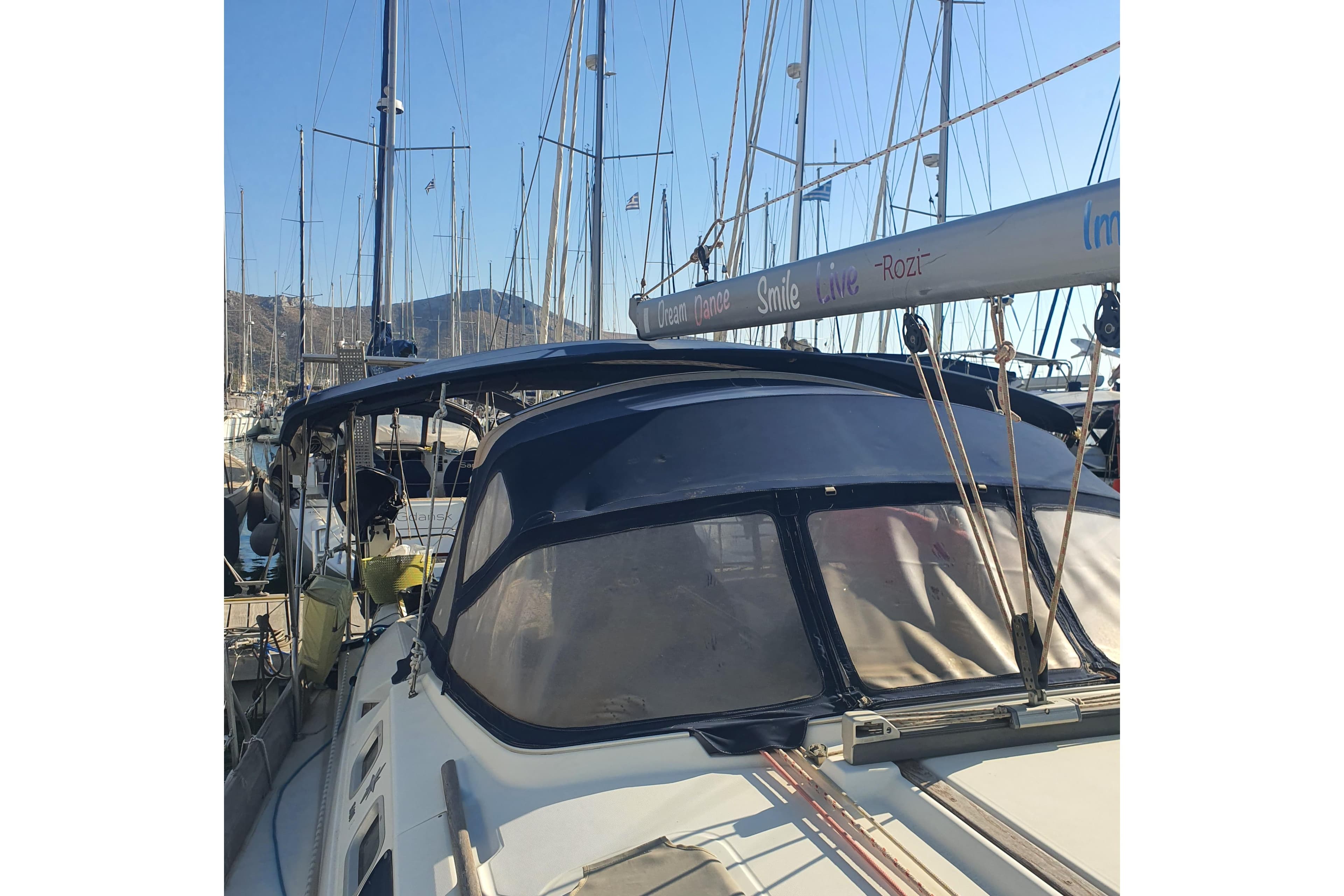 2004 Jeanneau Sun Odyssey 43 DS sailboat docked in marina, sunny day.